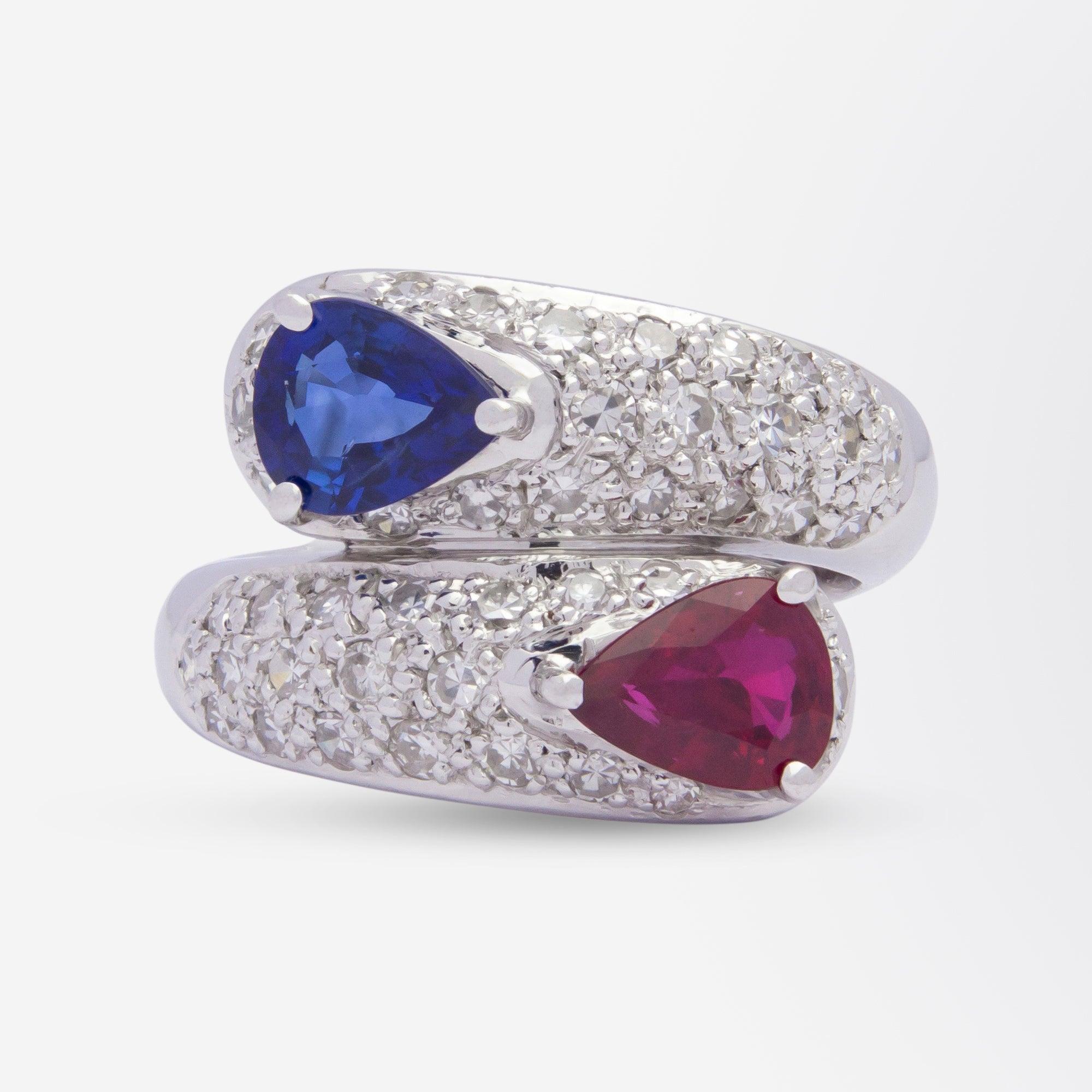 Modernist 18 Karat White Gold, Diamond, Ruby, and Sapphire Bypass Ring For Sale