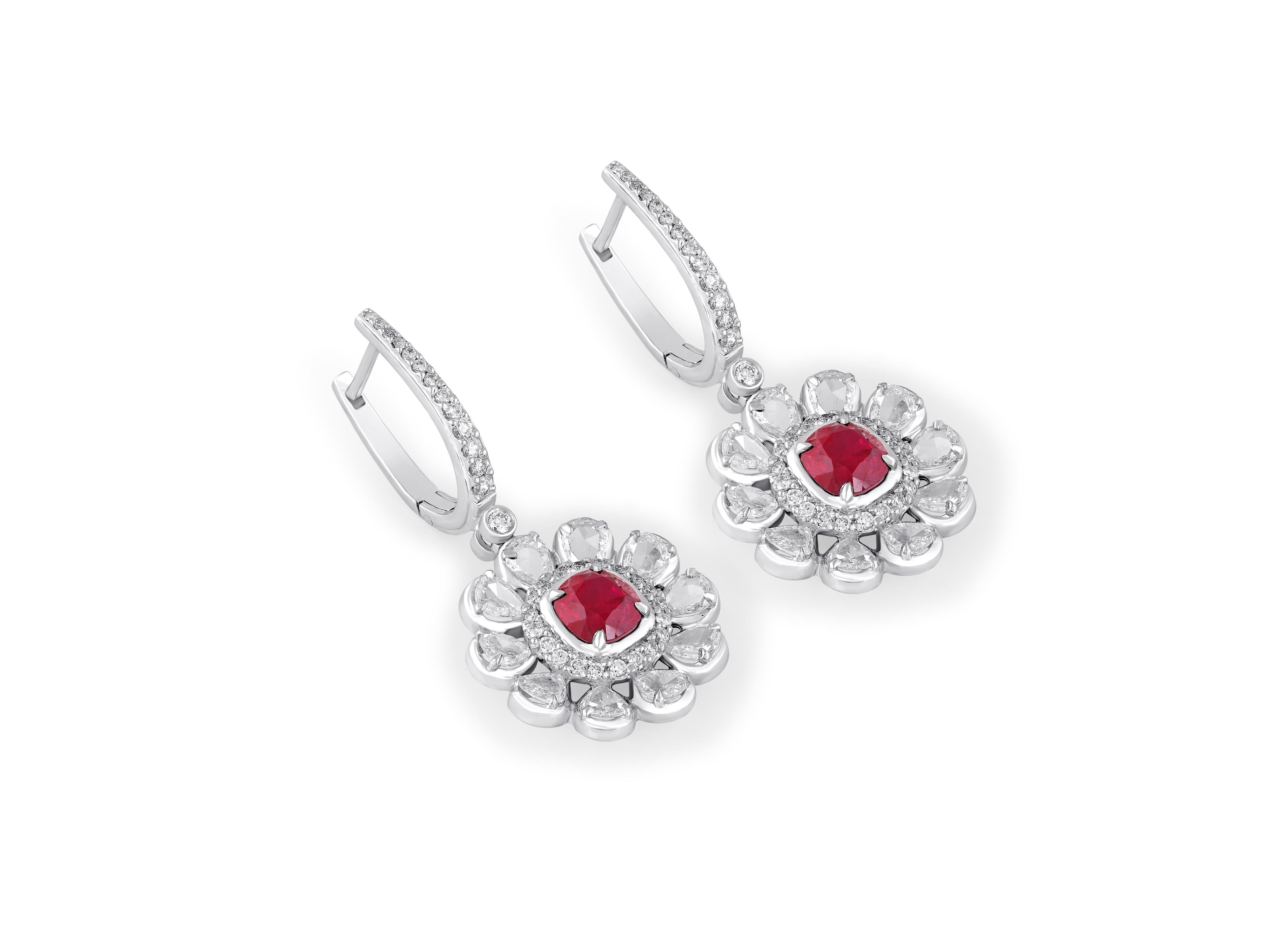 Beautiful flower-inspired diamond earrings with rose-cut diamonds and rubies. 
This dainty light weight design is a timeless classic piece of jewellery. 
Rubies represent nobility, purity, and passion. It is also a protective stone that can bring