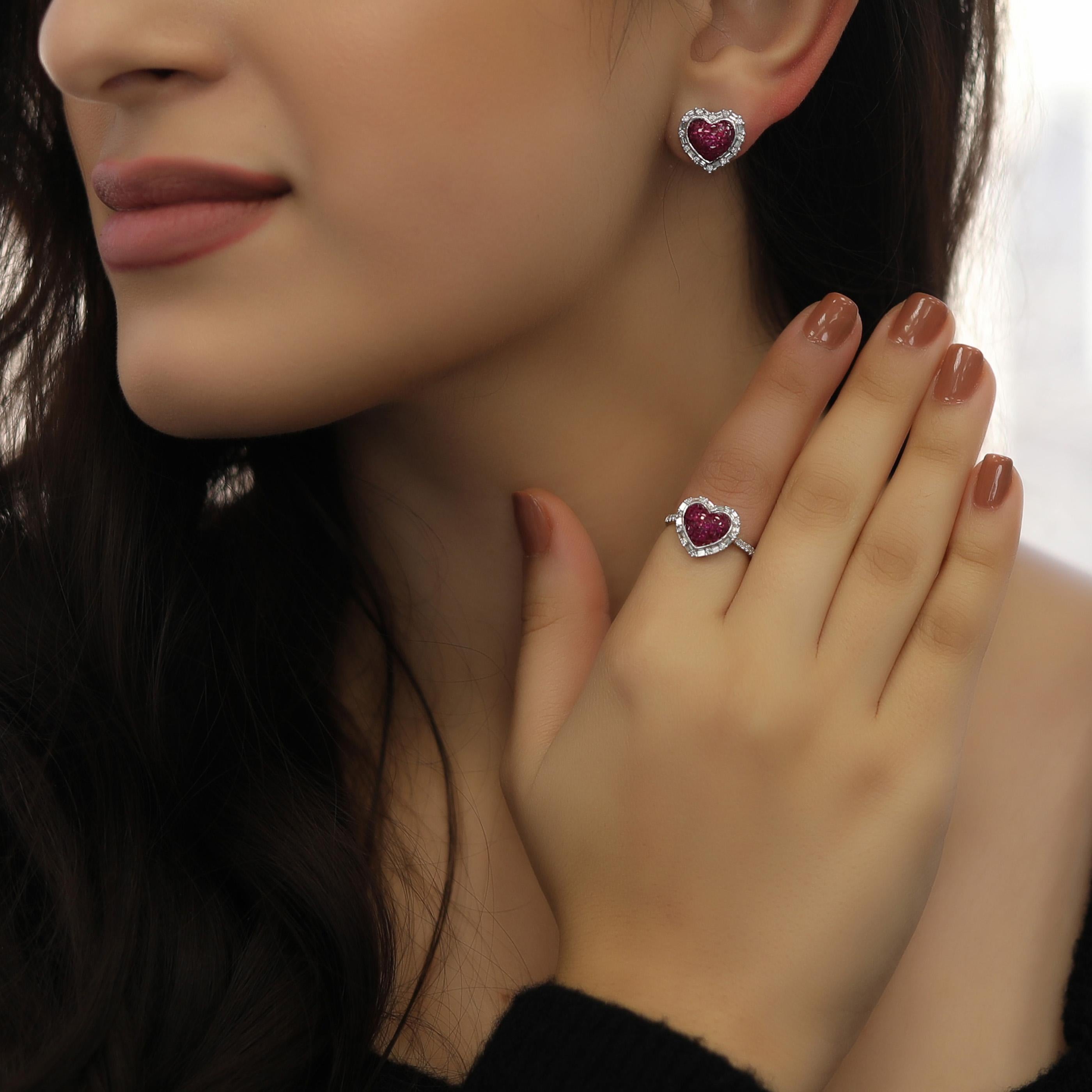 This ruby sweet heart earring and ring set is crafted in 18-karat white gold, weighing approximately 0.85 total carats of SI-H Quality white diamonds and 1.90 total carats of ruby. The ring is comfortable and can be sized 