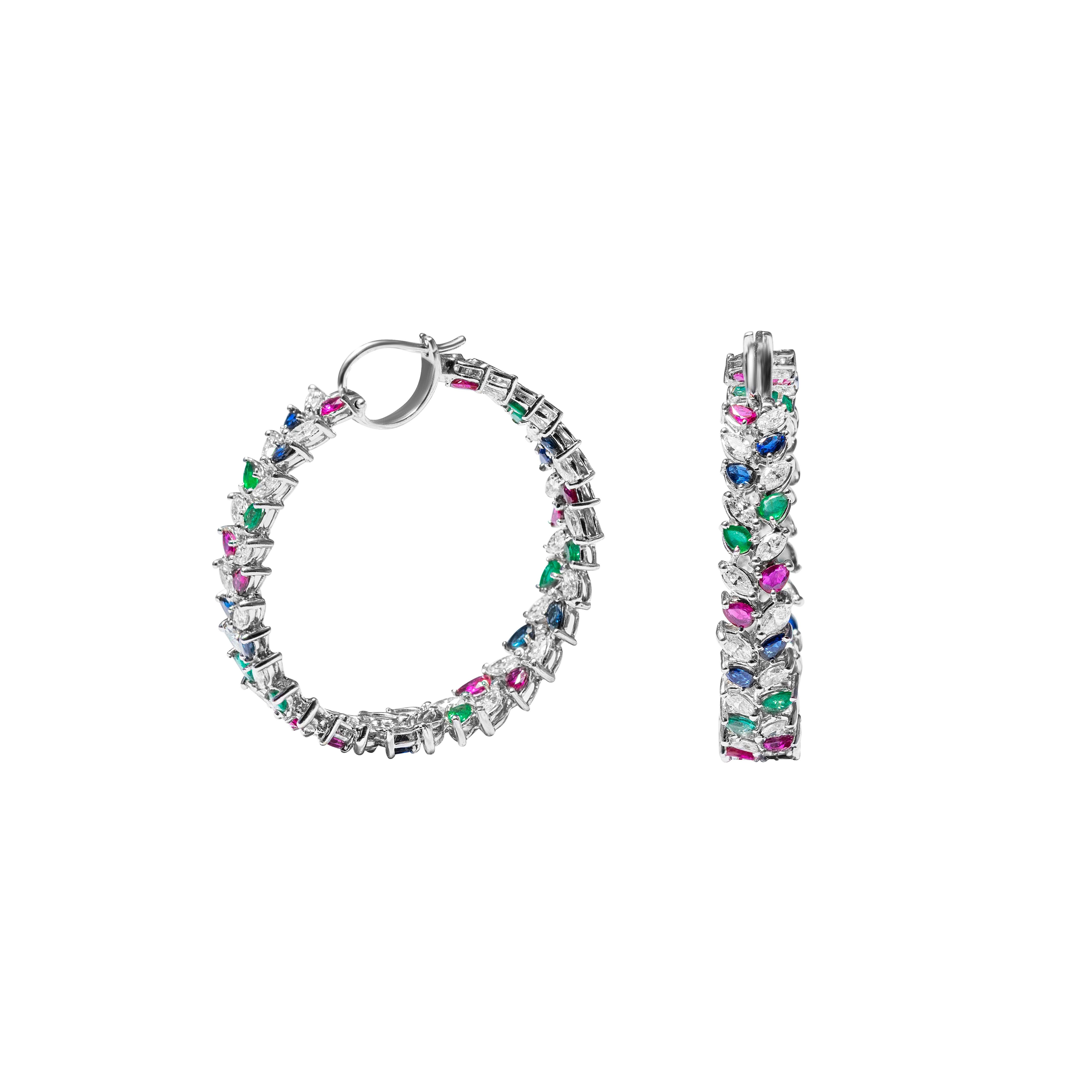 18 Karat White Gold Diamond, Ruby, Sapphire & Emerald Hoop Earrings

Exquisitely crafted, these stunning earrings set in 18 Karat white gold and studded with a mix of rubies, sapphires & emeralds, further accentuated by white diamonds are ideal for