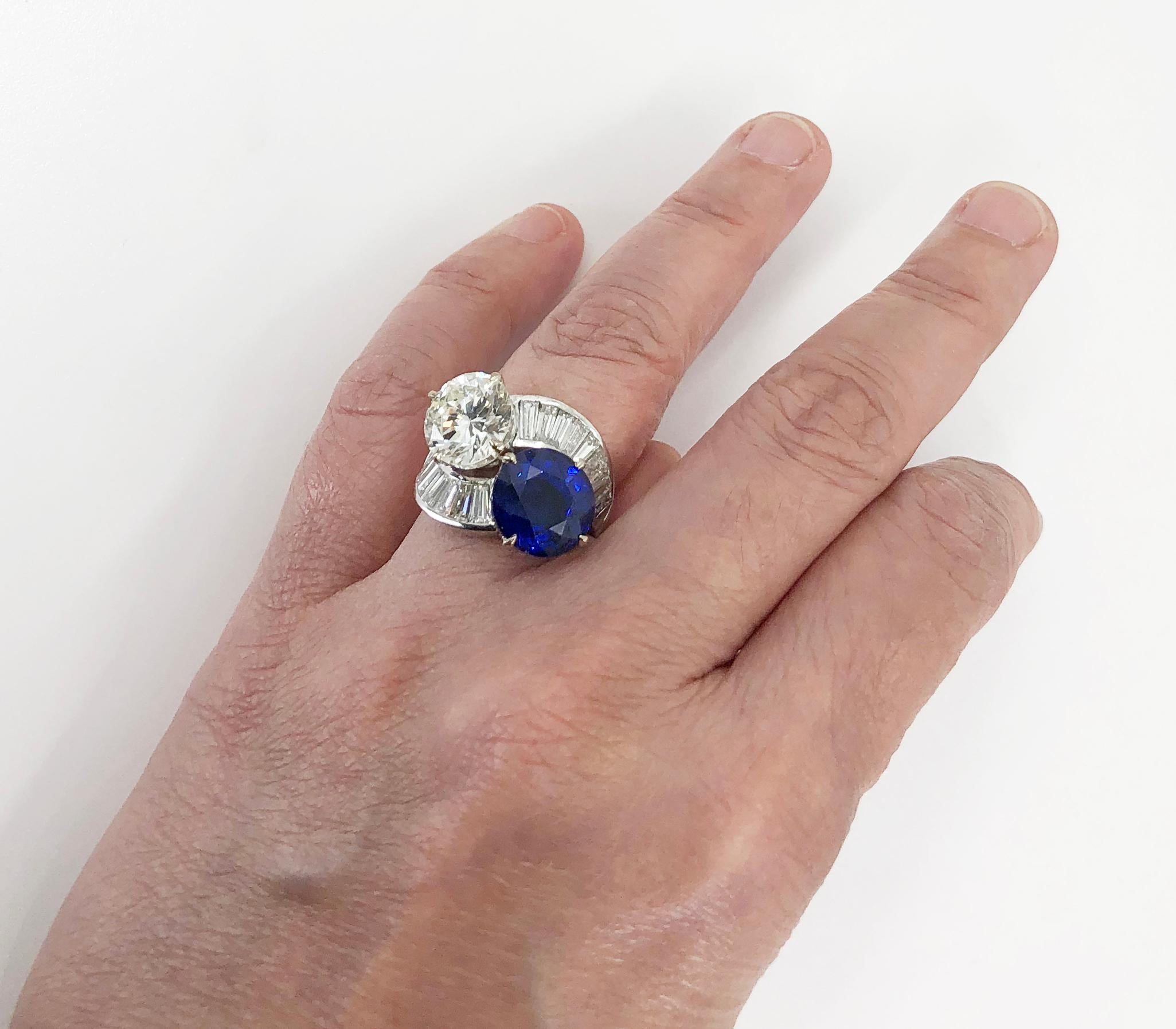 An iconic ‘Toi et Moi’ ring, crafted in 18k white gold featuring a large round cut diamond and a 9 carat round cut sapphire, each held by a row of baguette cut diamonds. Sapphire – approx. 9cts. and 4cts. of diamonds.