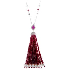18 Karat White Gold Diamond, Sapphire, Ruby, and Pearl Tassel Pendant Necklace