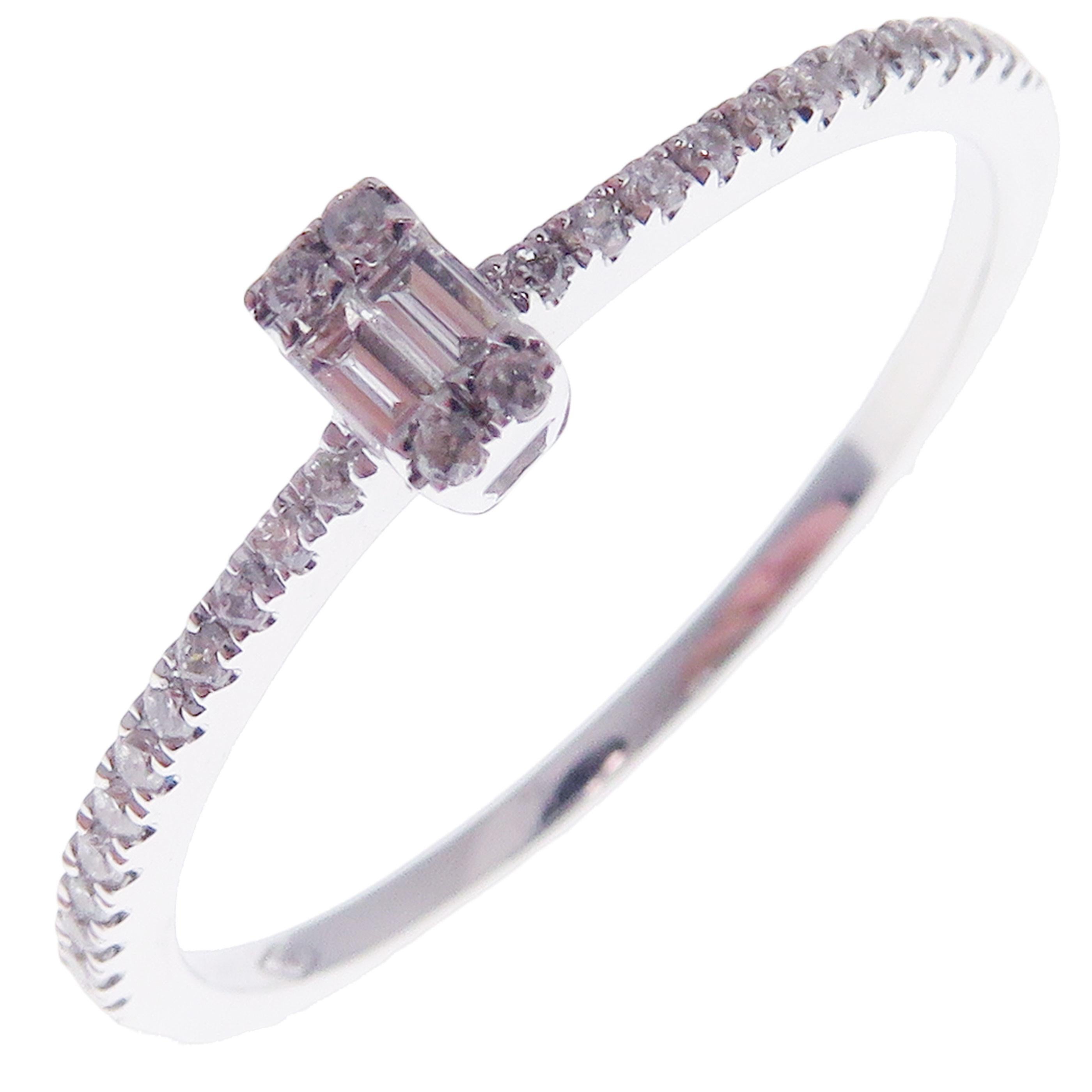 This simple stackable illusion ring is crafted in 18-karat white gold, featuring 28 round white diamonds totaling of 0.11 carats and 2 baguette white diamond totaling of 0.06 carats.
Approximate total weight 1.54 grams.
Standard Ring size 7
SI-G