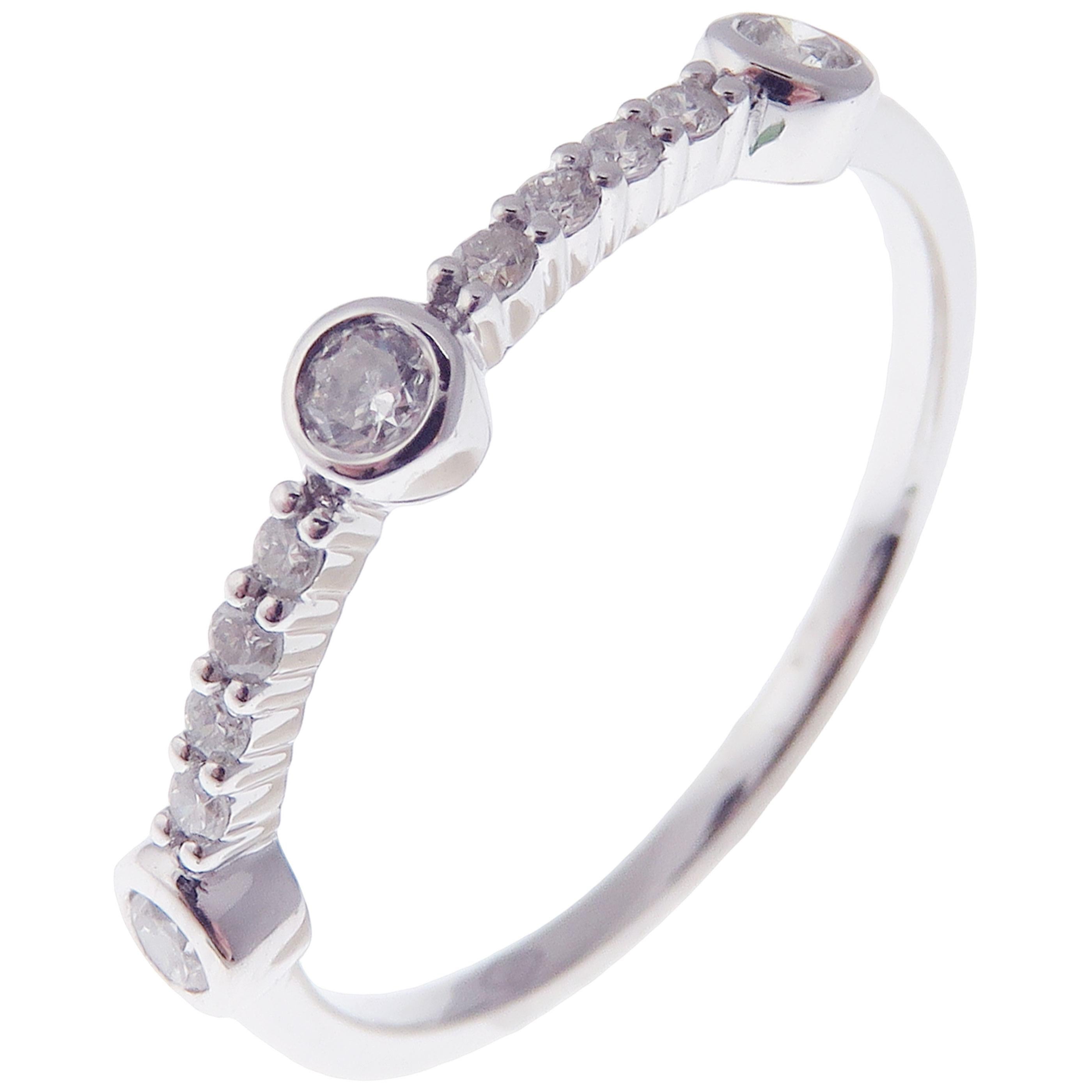 This simple three-stone stackable ring is crafted in 18-karat white gold, featuring 11 round white diamonds totaling of 0.22 carats.
Approximate total weight 1.83 grams.
Standard Ring size 7
SI-G Quality natural white diamonds.