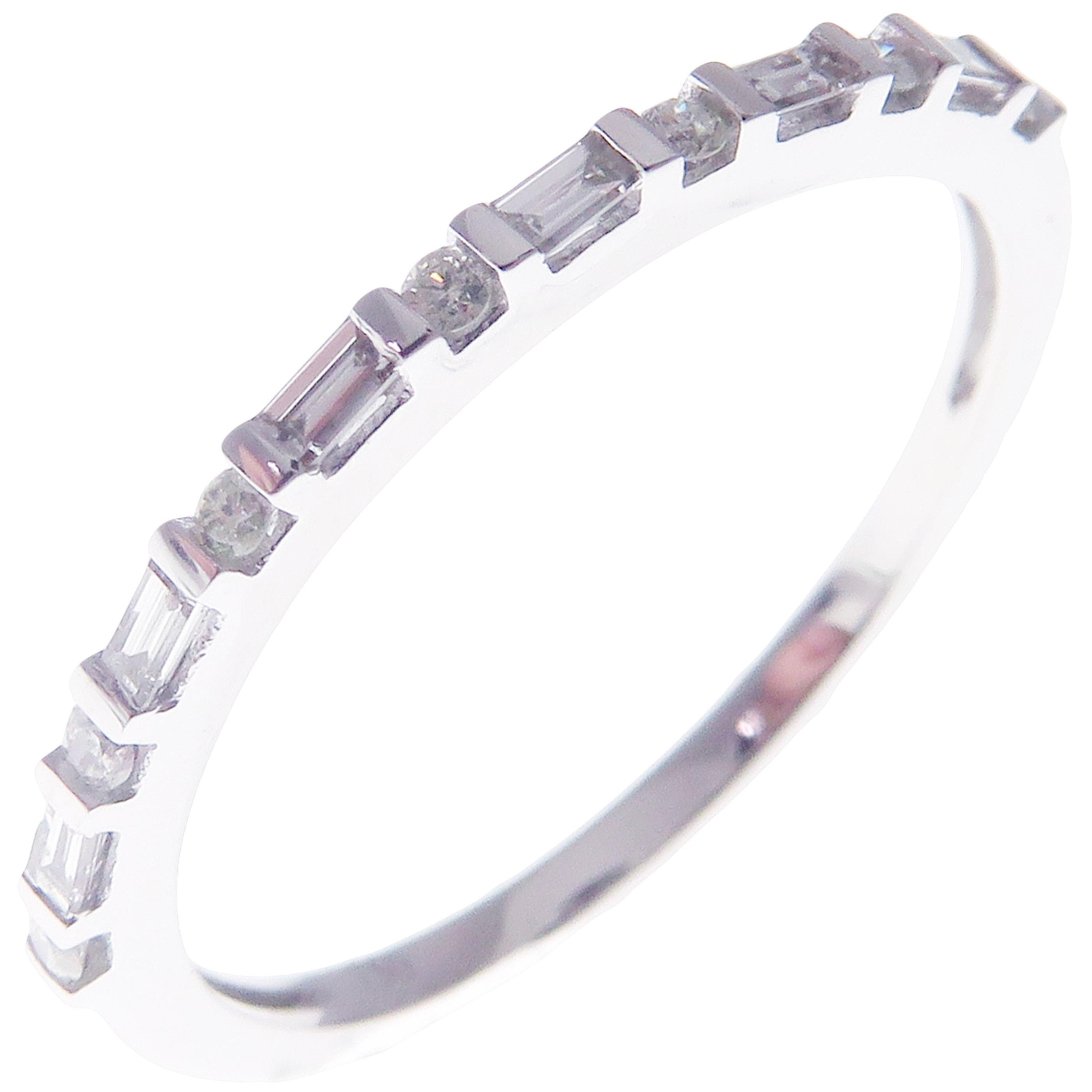 This simple stackable band is crafted in 18-karat white gold, featuring 7 round white diamonds totaling of 0.08 carats and 6 baguette white diamonds totaling of 0.10 carats.
Approximate total weight 1.42 grams.
Standard Ring size 7
SI-G Quality