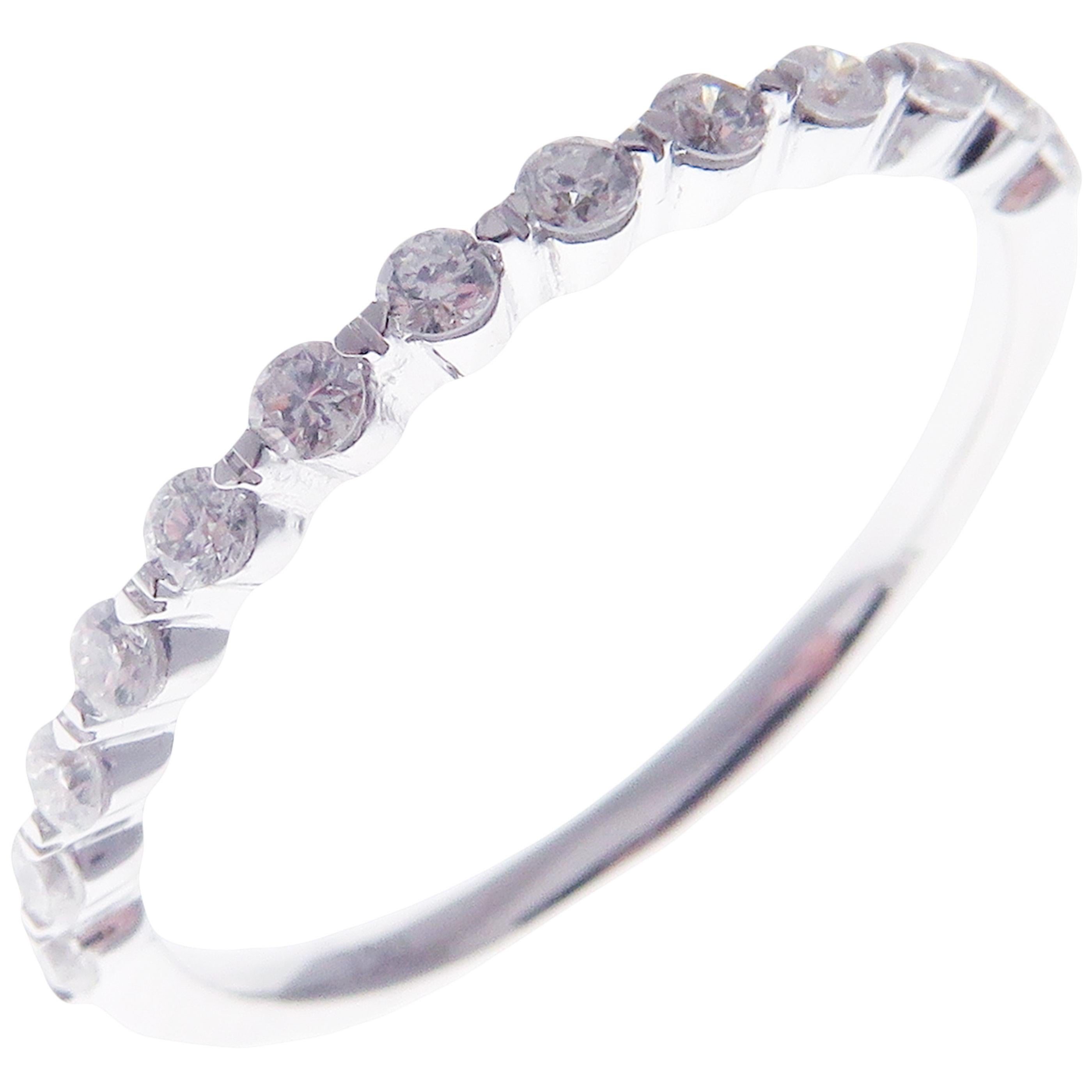 This simple stackable ring is crafted in 18-karat white gold, featuring 13 round white diamonds totaling of 0.28 carats.
Approximate total weight 1.47 grams.
Standard Ring size 7
SI-G Quality natural white diamonds.