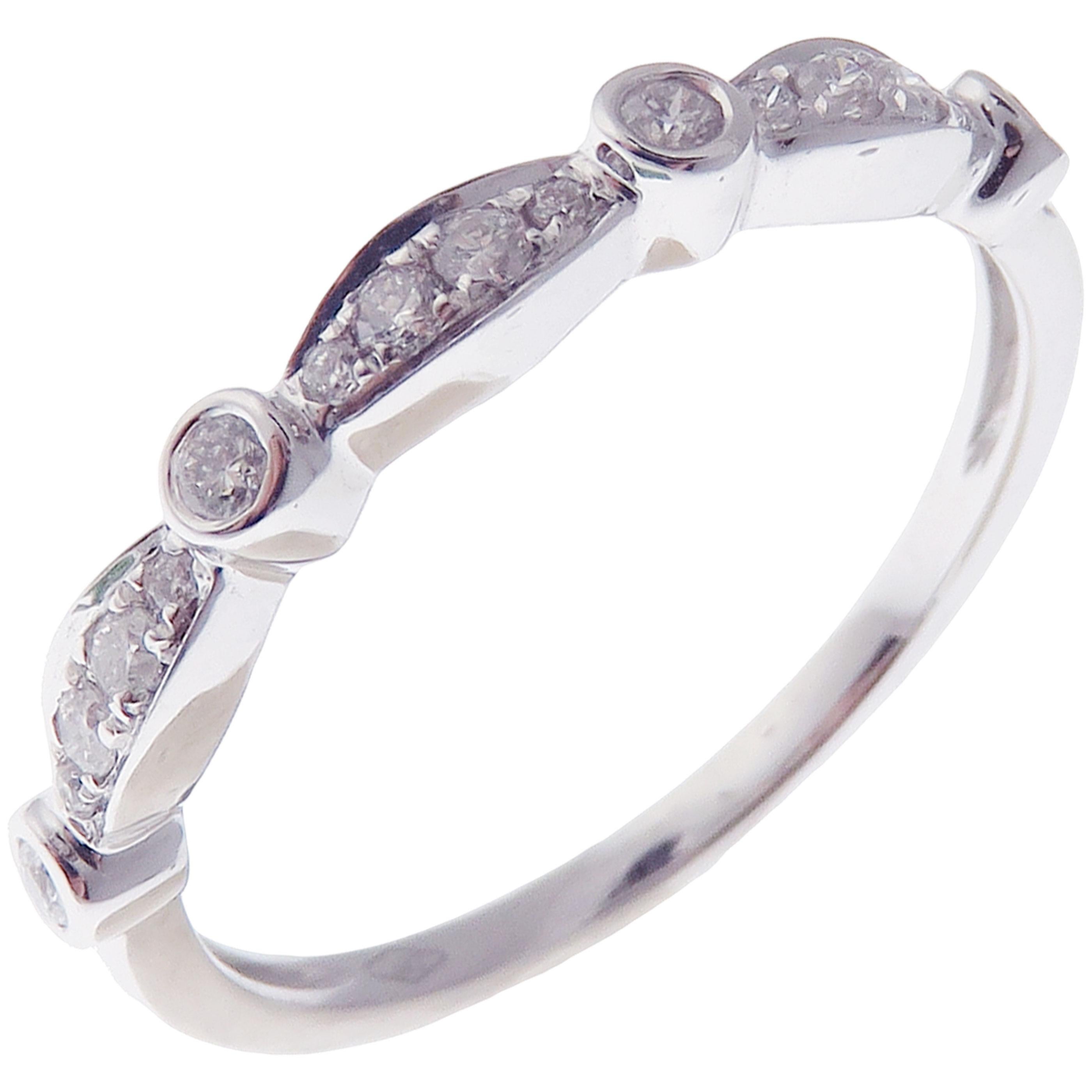 This simple stackable ring is crafted in 18-karat white gold, featuring 17 round white diamonds totaling of 0.18 carats.
Approximate total weight 1.94 grams.
Standard Ring size 7
SI-G Quality natural white diamonds.