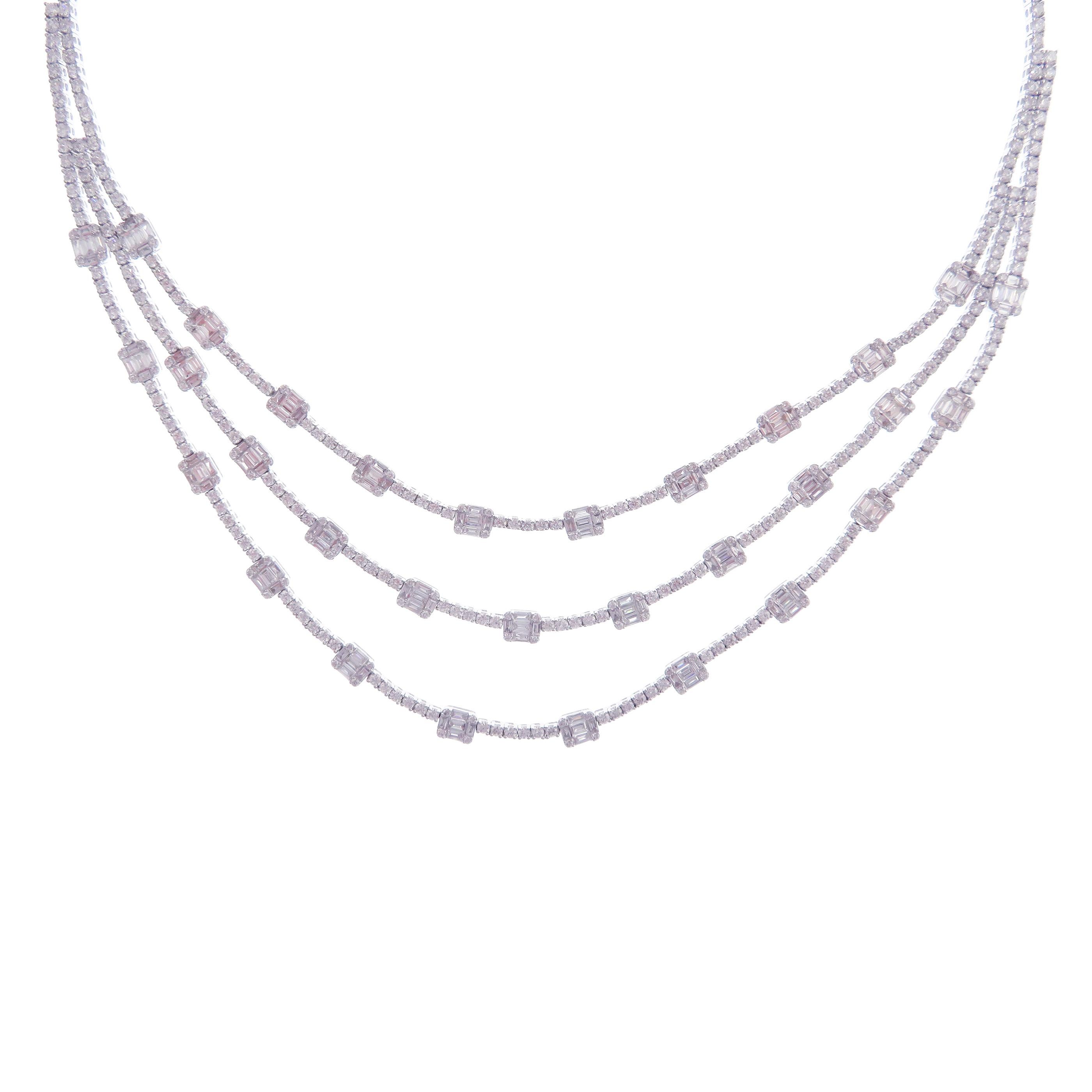 This simple triple strand necklace is crafted in 18-karat white gold, weighing approximately 16.36 total carats of V Quality white diamond. These are very comfortable, flexible, and lay flat. 

Necklace is 16