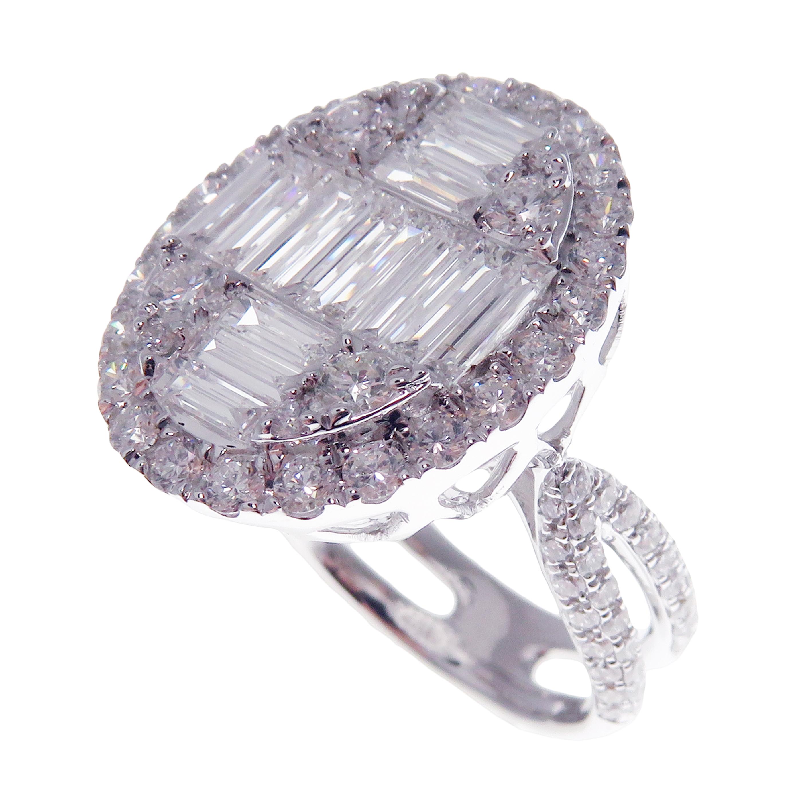 This baguette oval diamond ring is crafted in 18-karat white gold, weighing approximately 2.92 total carats of SI-V Quality white diamonds. Diamond embellishments on ring shank and a modern design brings out the beauty of the ring. This ring is