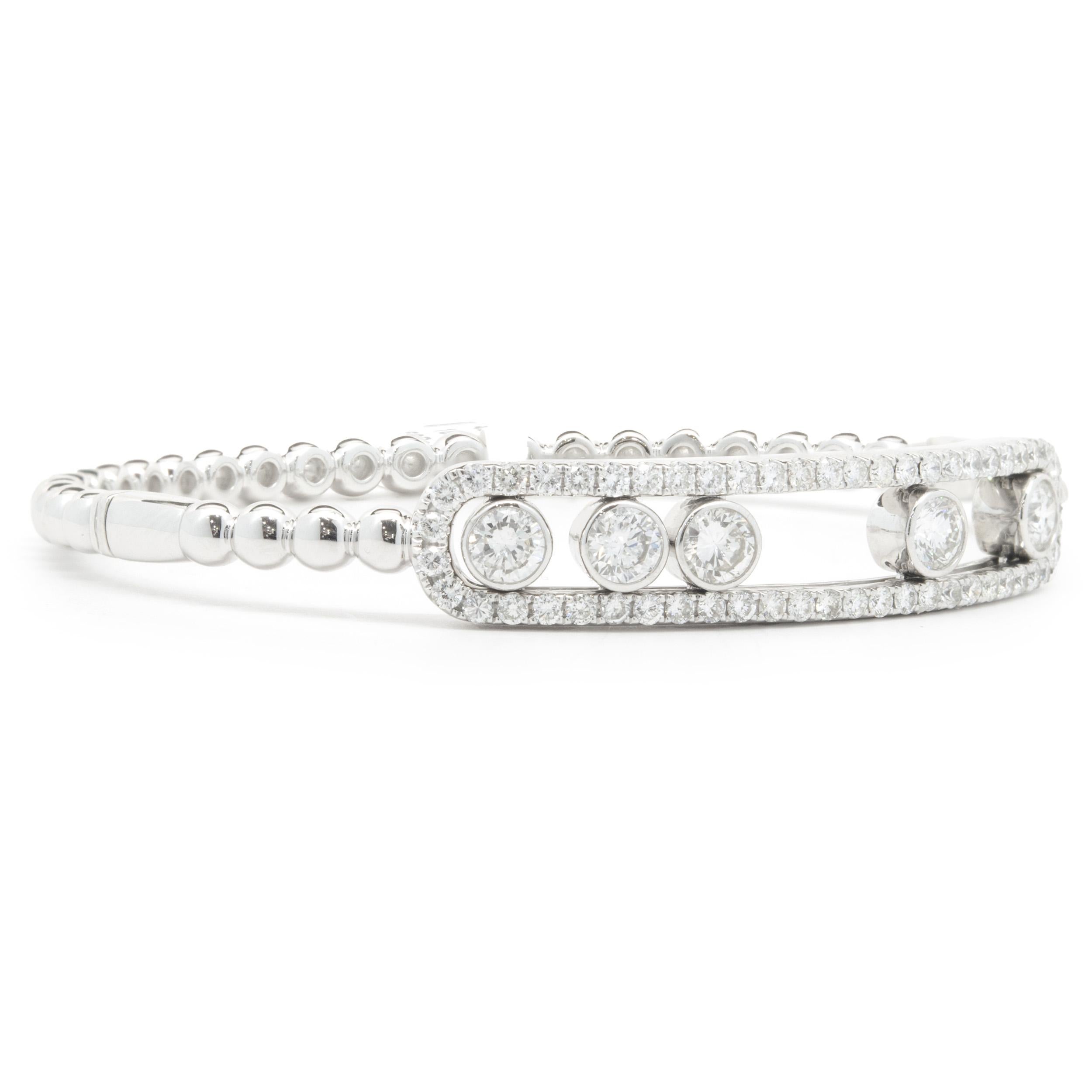 Designer: custom
Material: 18K white gold
Diamonds: 59 round brilliant cut = 2.25cttw
Color: F / G
Clarity: VS1-2
Dimensions: bracelet will fit up to a 7.5-inch wrist
Weight: 21.51 grams