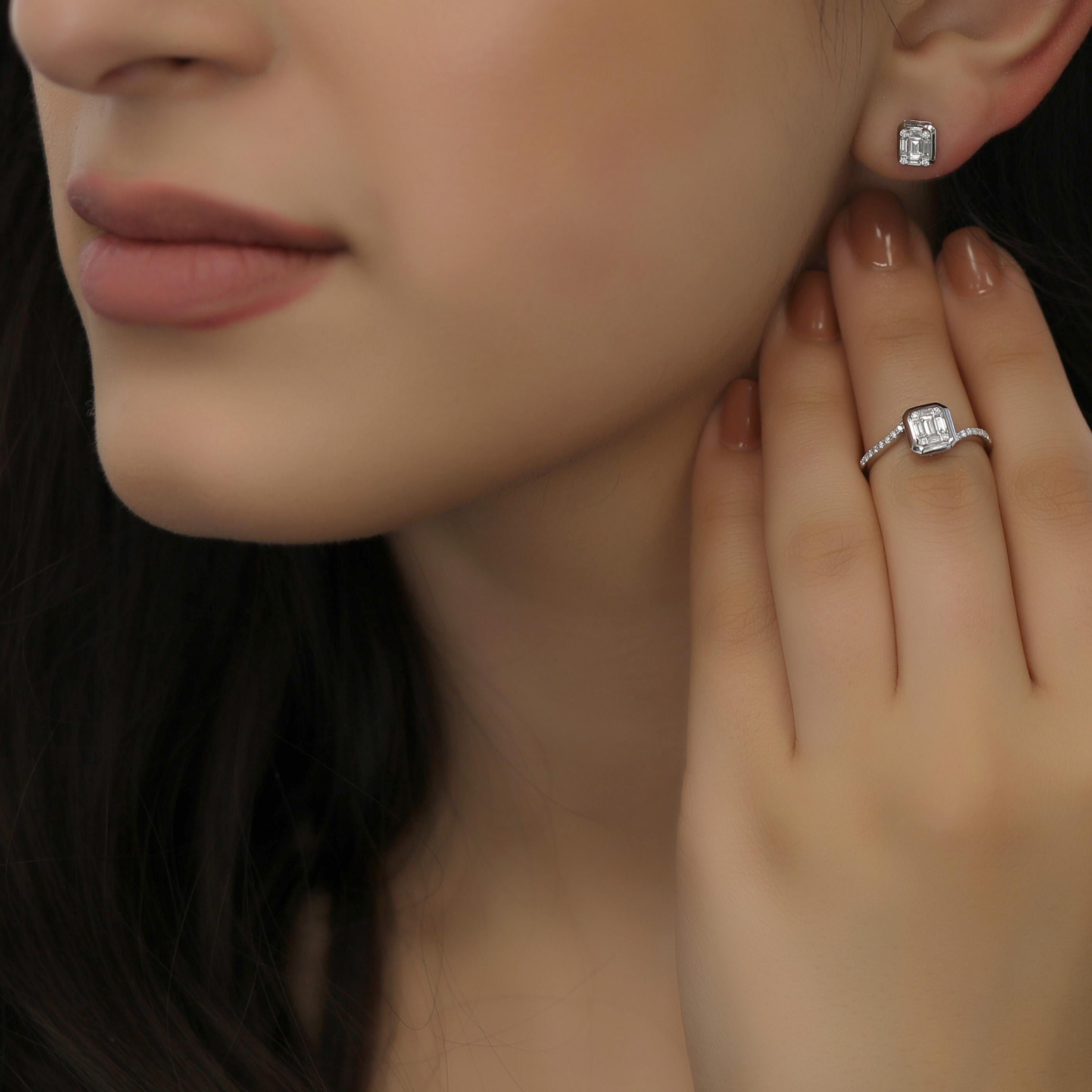 This small diamond earring and ring set is crafted in 18-karat white gold, weighing approximately 0.70 total carats of SI-H Quality white diamonds. The ring is comfortable and can be sized 