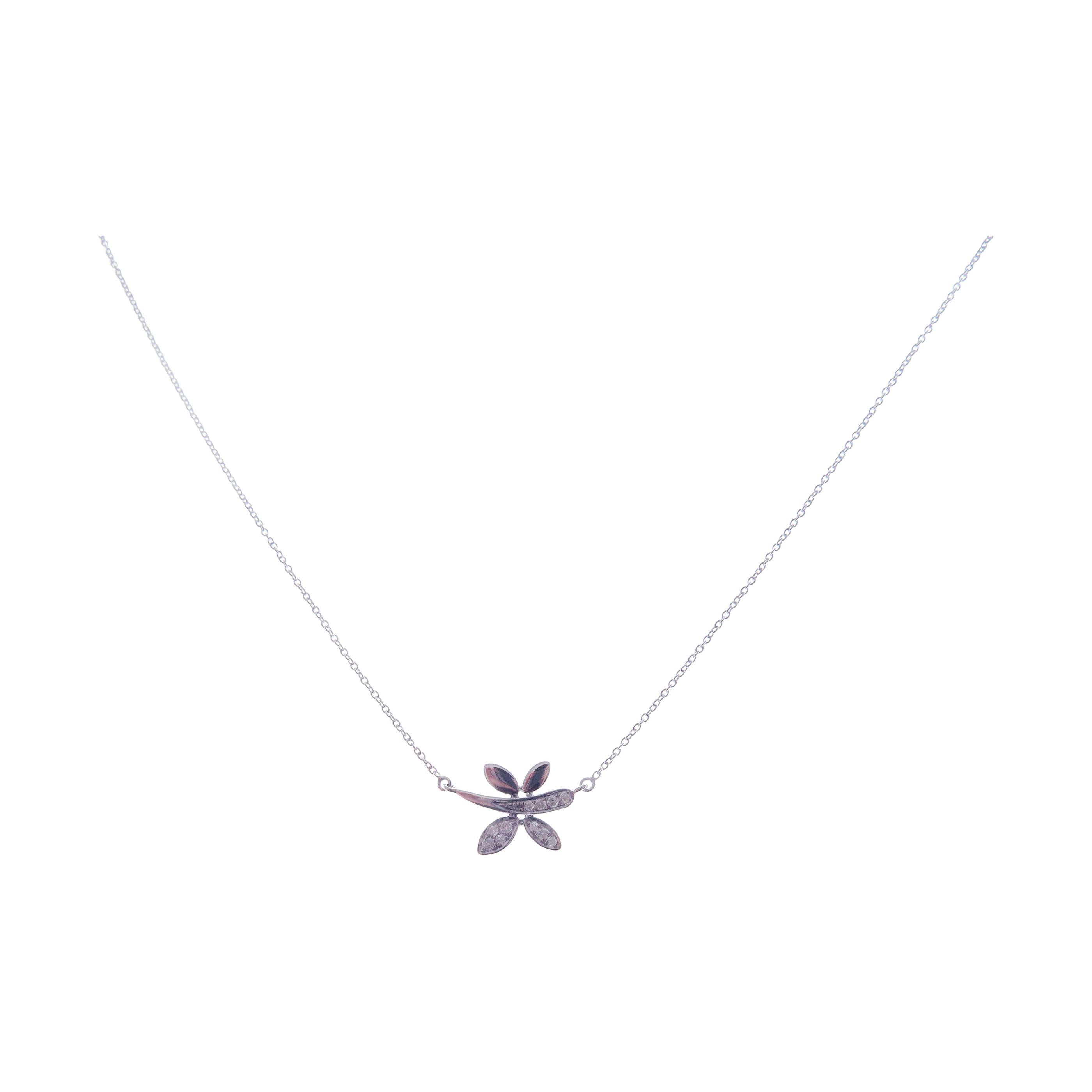 This small dragonfly necklace is crafted in 18-karat white gold, weighing approximately 0.06 total carats of SI-H Quality white diamond. 

Necklace is 16