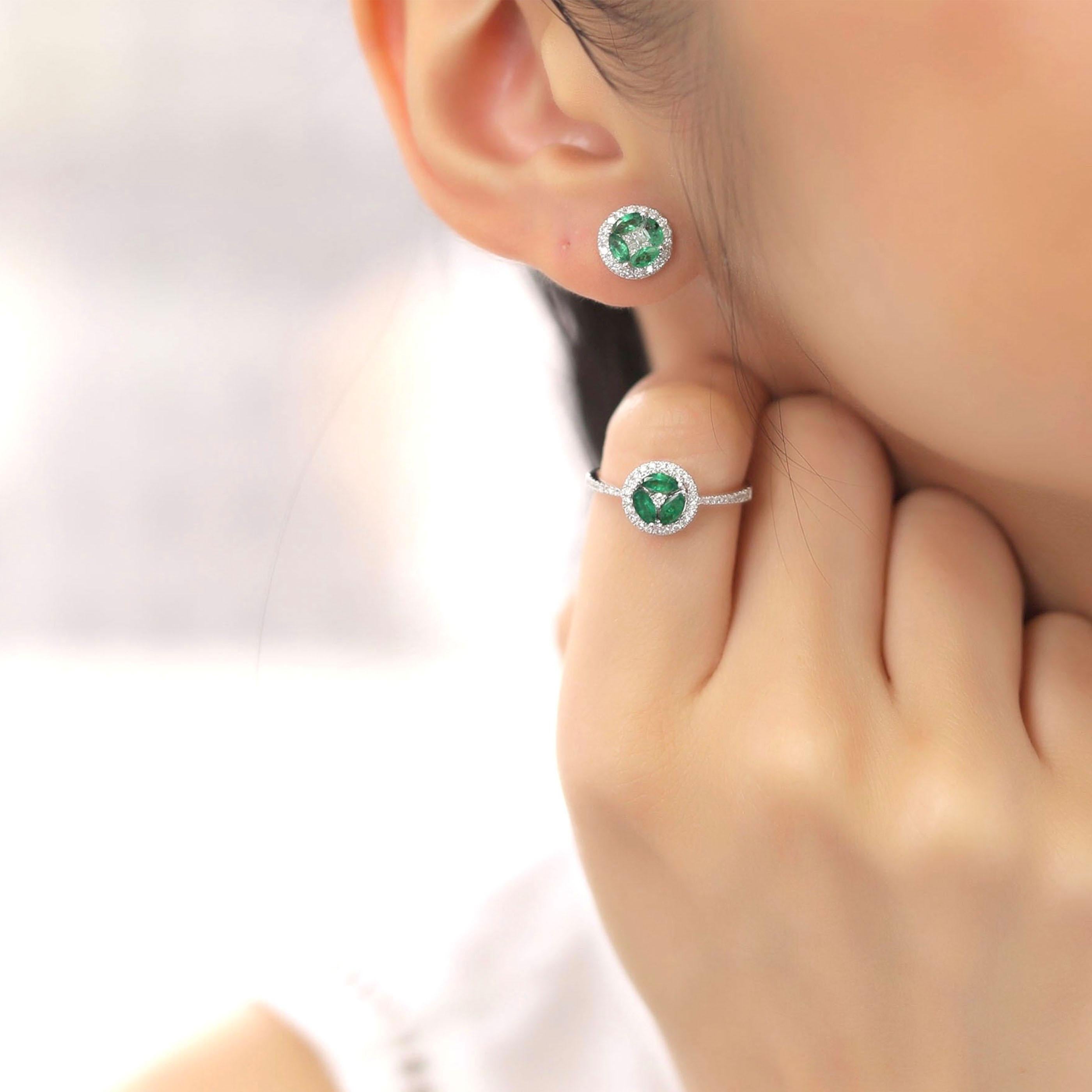 This small emerald circle earring and ring set is crafted in 18-karat white gold, weighing approximately 0.94 total carats of SI-H Quality white diamonds and 0.88 total carats of emerald stones. The ring is comfortable and can be sized 