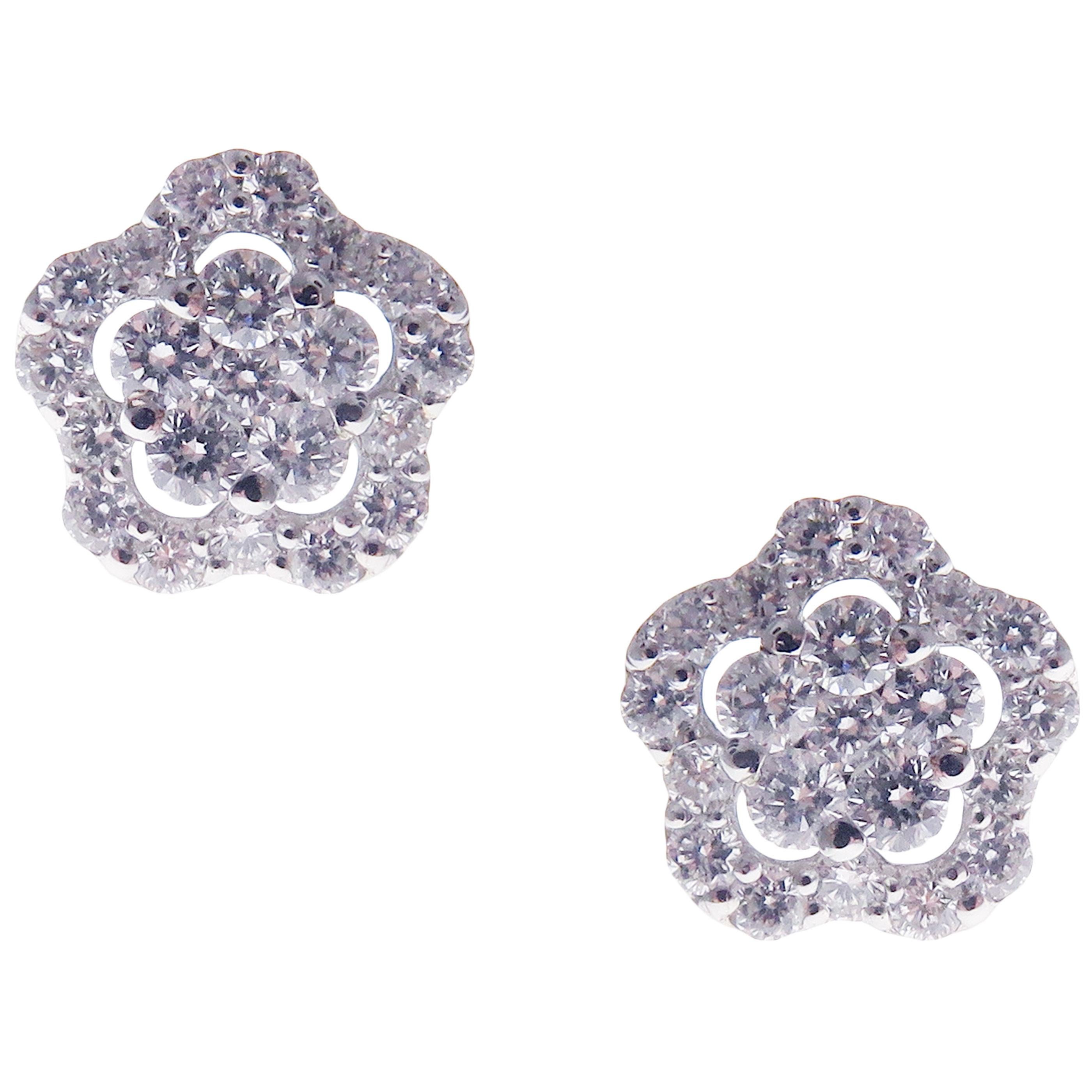 This classic diamond flower stud earring is crafted in 18-karat white gold, featuring 42 round white diamonds totaling of 0.48 carats.
Approximate total weight 1.65 grams.
These earrings come with push back post backings.
SI-G Quality natural white