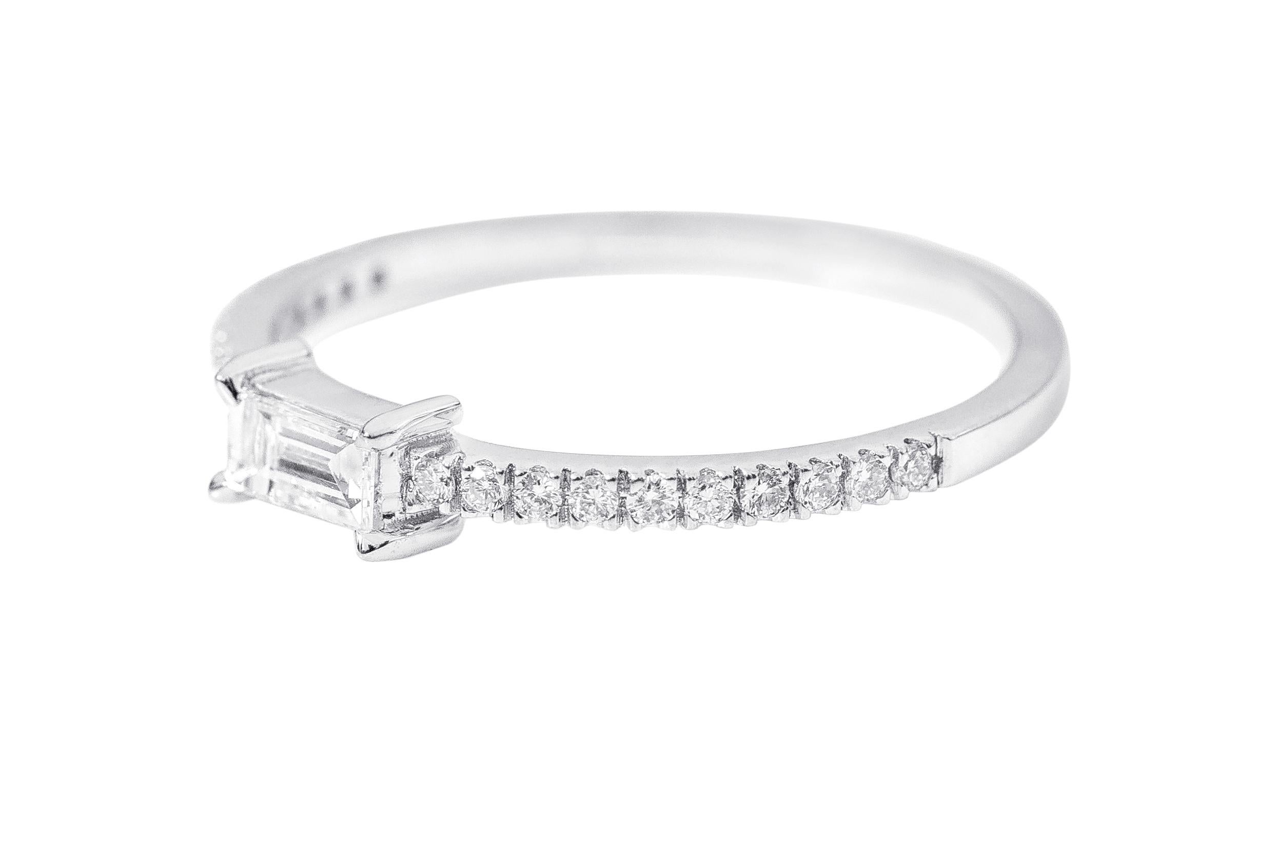 18 Karat White Gold Diamond Solitaire Eternity Band Ring

This exquisite diamond ring is scintillating. The solitaire baguette cut diamond in eagle prong box setting in rose gold is perfect. The thin band of half pave-set round diamonds and