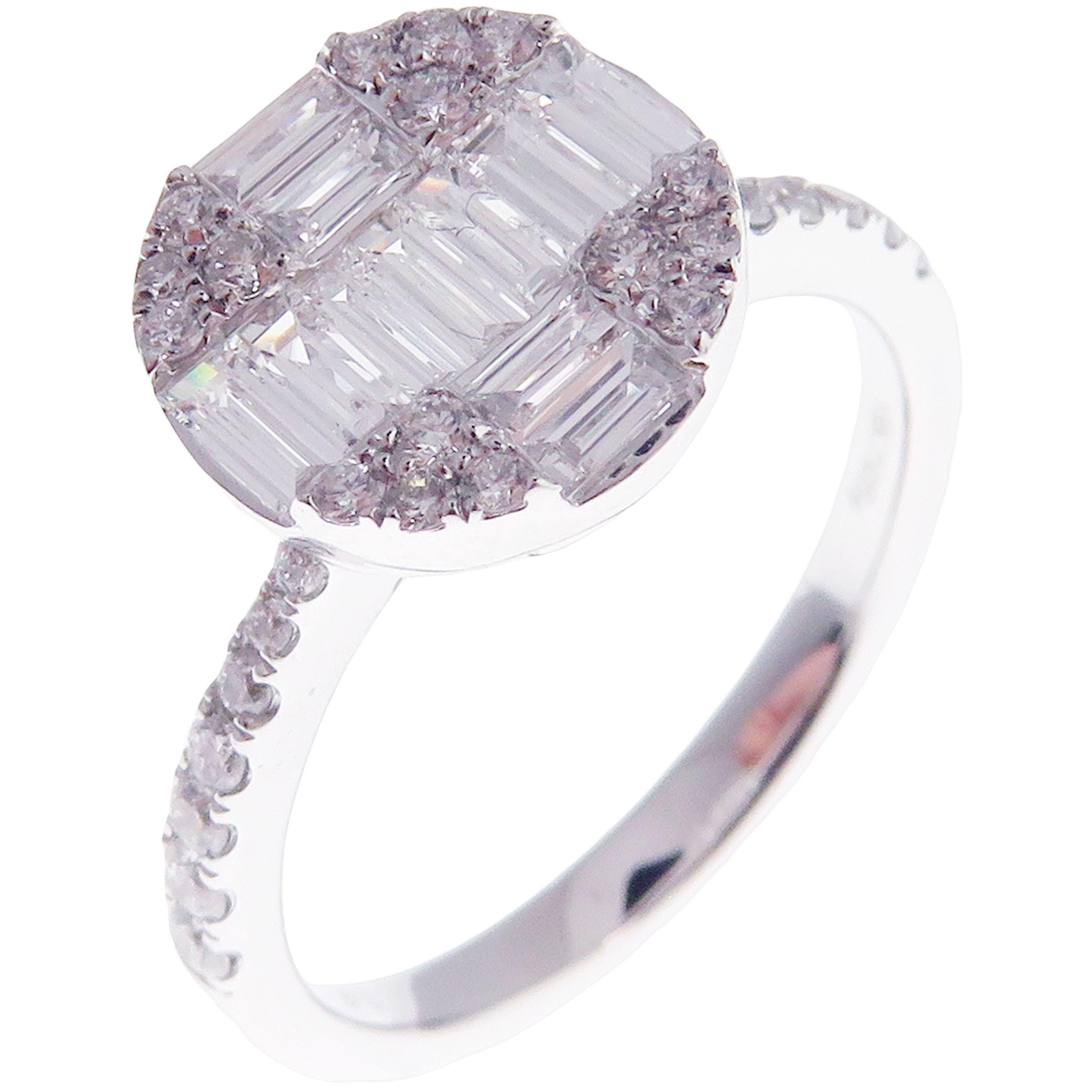 This medium version of diamond solitaire illusion ring is crafted in 18-karat white gold, featuring 30 round white diamonds totaling of 0.26 carats and 11 baguette white diamonds totaling of 0.43 carats.
Approximate total weight 3.06 grams.
Standard