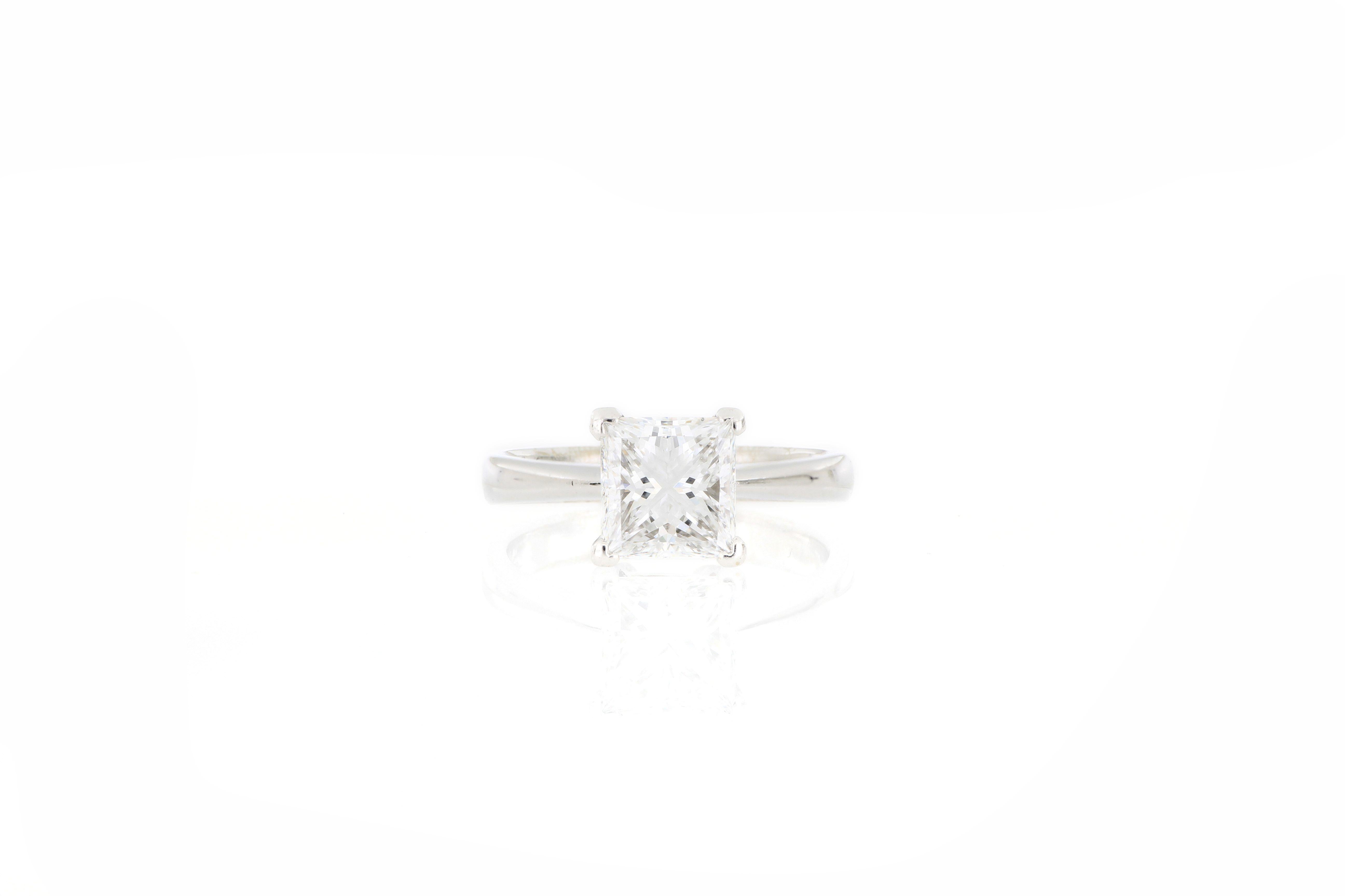 A square modified brilliant diamonds weighing 2.00 carats, mounted in 18 karat white gold. A very beautiful solitaire ring set with a diamond of top colour (D) grade, clarity grade of VS2 and very good polish and symmetry, without