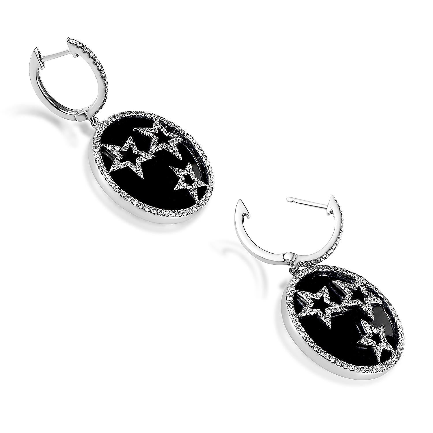 Playful yet elegant, these diamond earrings are perfect for a refined woman who knows how to have a good time. These 18K white gold earrings suspend a sleek black stone that provides the perfect contrast for pave set diamonds that encircle it and