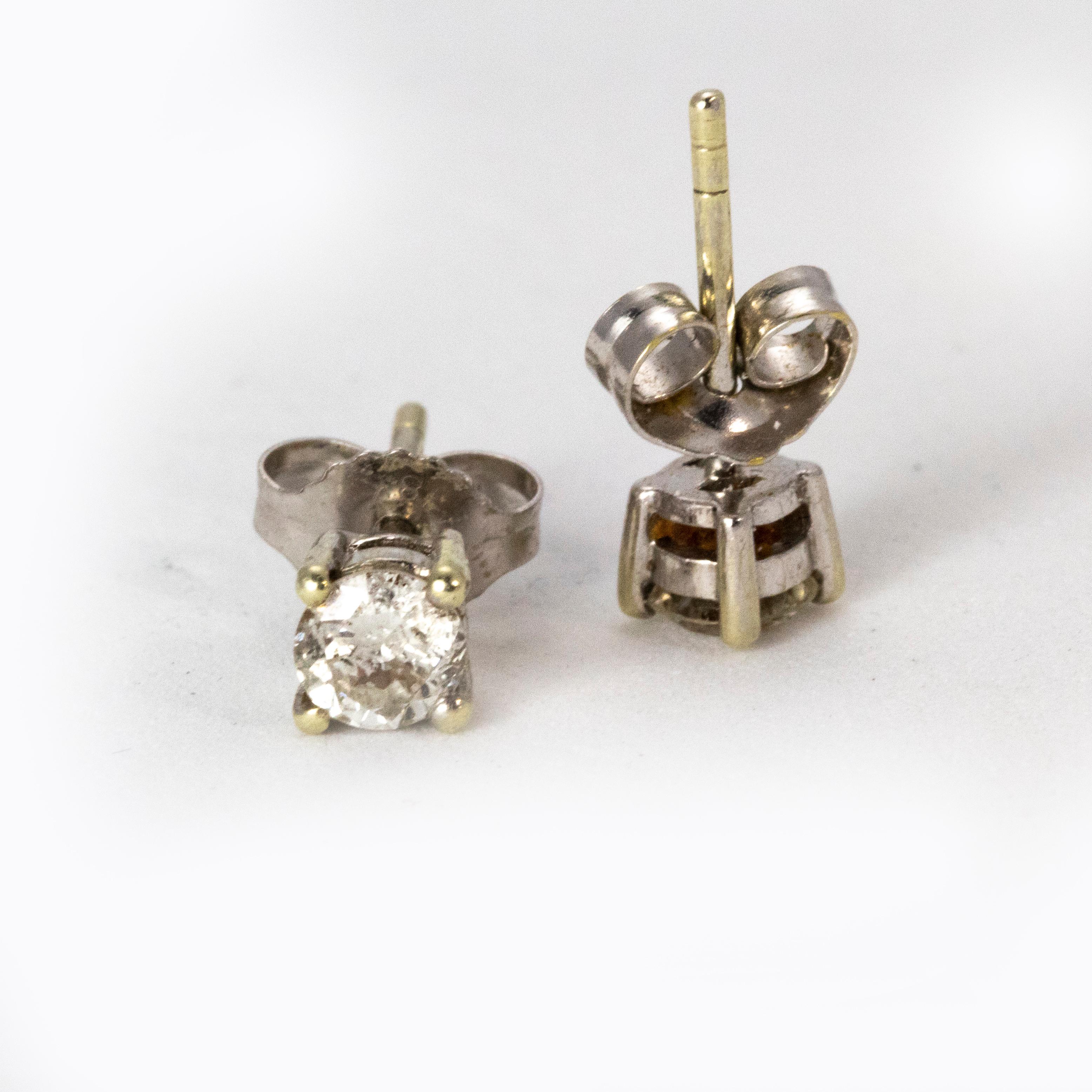 A pretty pair of diamond stud earrings, with a total diamond rate of 0.5 carats. Each stud is four claw set in 18k white gold. On a post and butterfly fitting.
