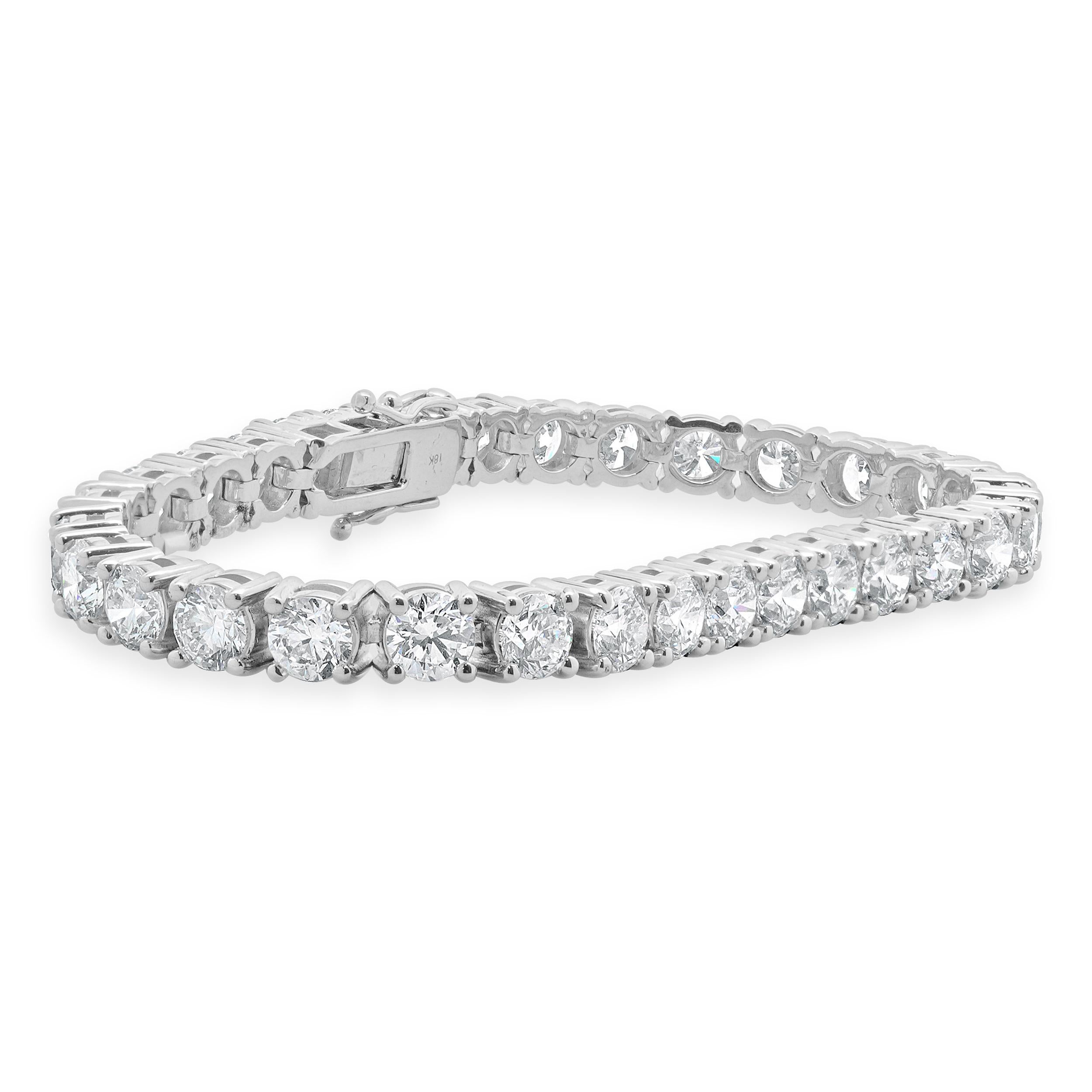Designer: custom design
Material: 18K white Gold
Diamond: 32 round brilliant cut = 16.25cttw
Color: G
Clarity: VS
Dimensions: bracelet will fit up to a 7-inch wrist
Weight: 27.16 grams
