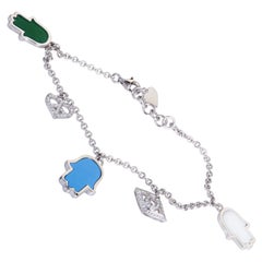 18 Karat White Gold Diamond Turquoise and Agate Charm Bracelet