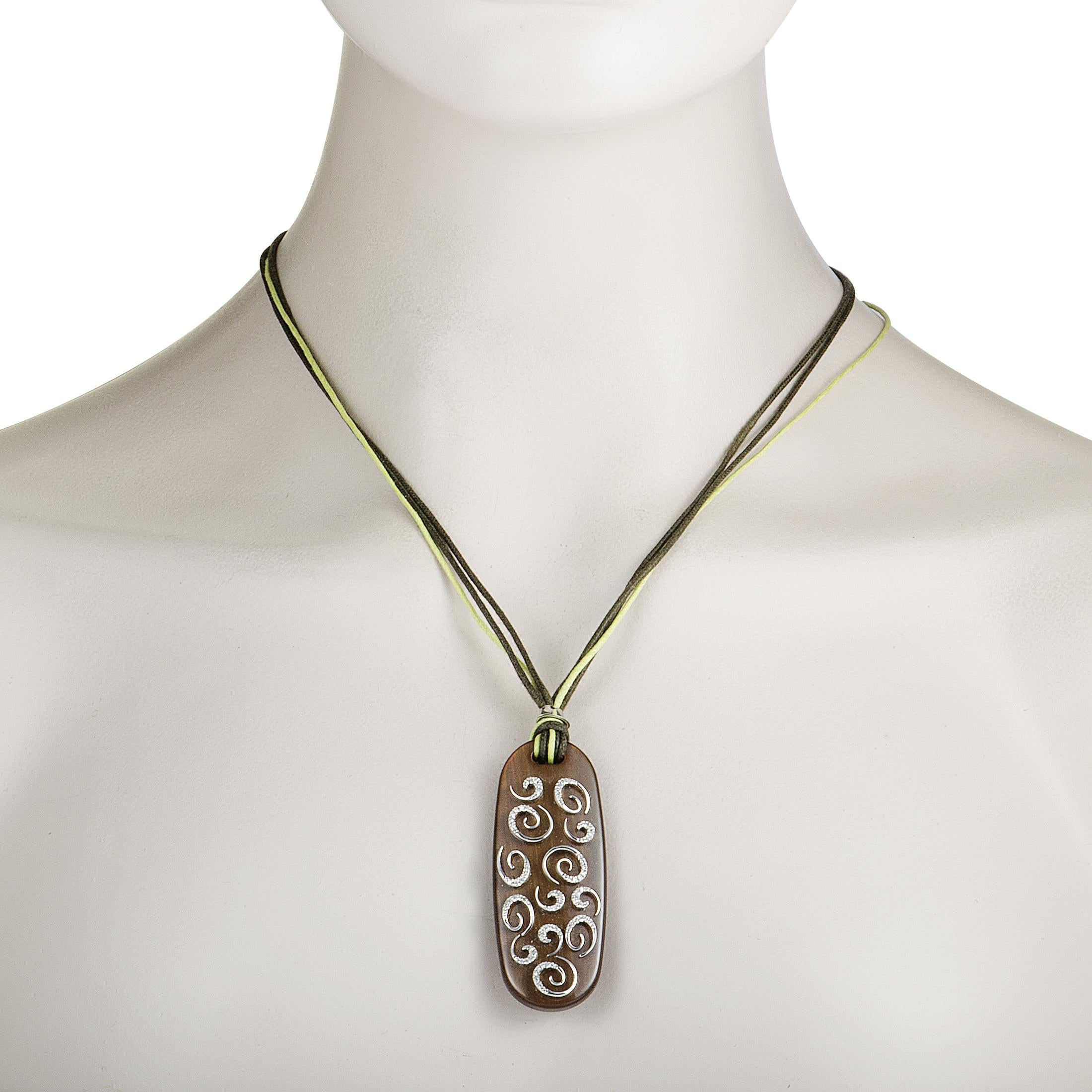 This incredible necklace is like nothing you've seen before! Its stunning pendant is made from shimmering 18K white gold and wood and adorned with dazzling diamonds.
