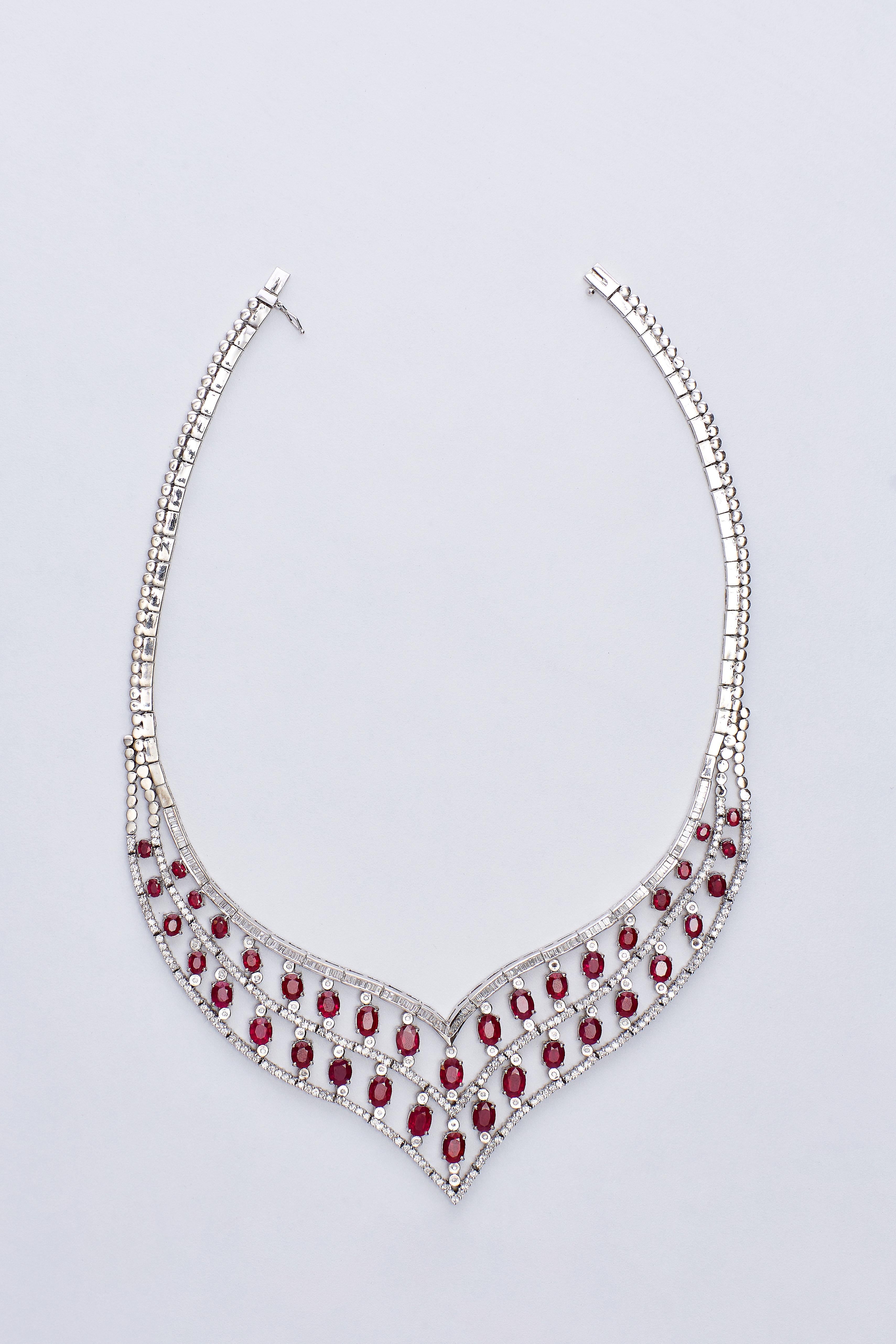 Elegant 18 Karat White Gold Diamonds and Rubies Necklace 
Stunning Natural Ruby and Diamonds collier, beautiful design of 18K white gold.
Ruby Burma approx. 26.5 ct and Diamonds approx. 10.5 ct F VS1.
Total weight: 89 grams.