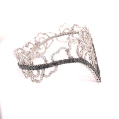 18 Karat White Gold Dimond and Black Diamond Floral Bracelet