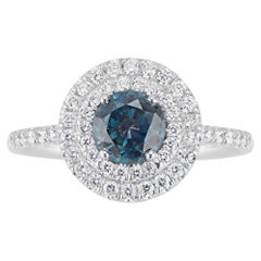 Bague en or blanc 18 carats avec double halo de diamants et saphirs du Montana