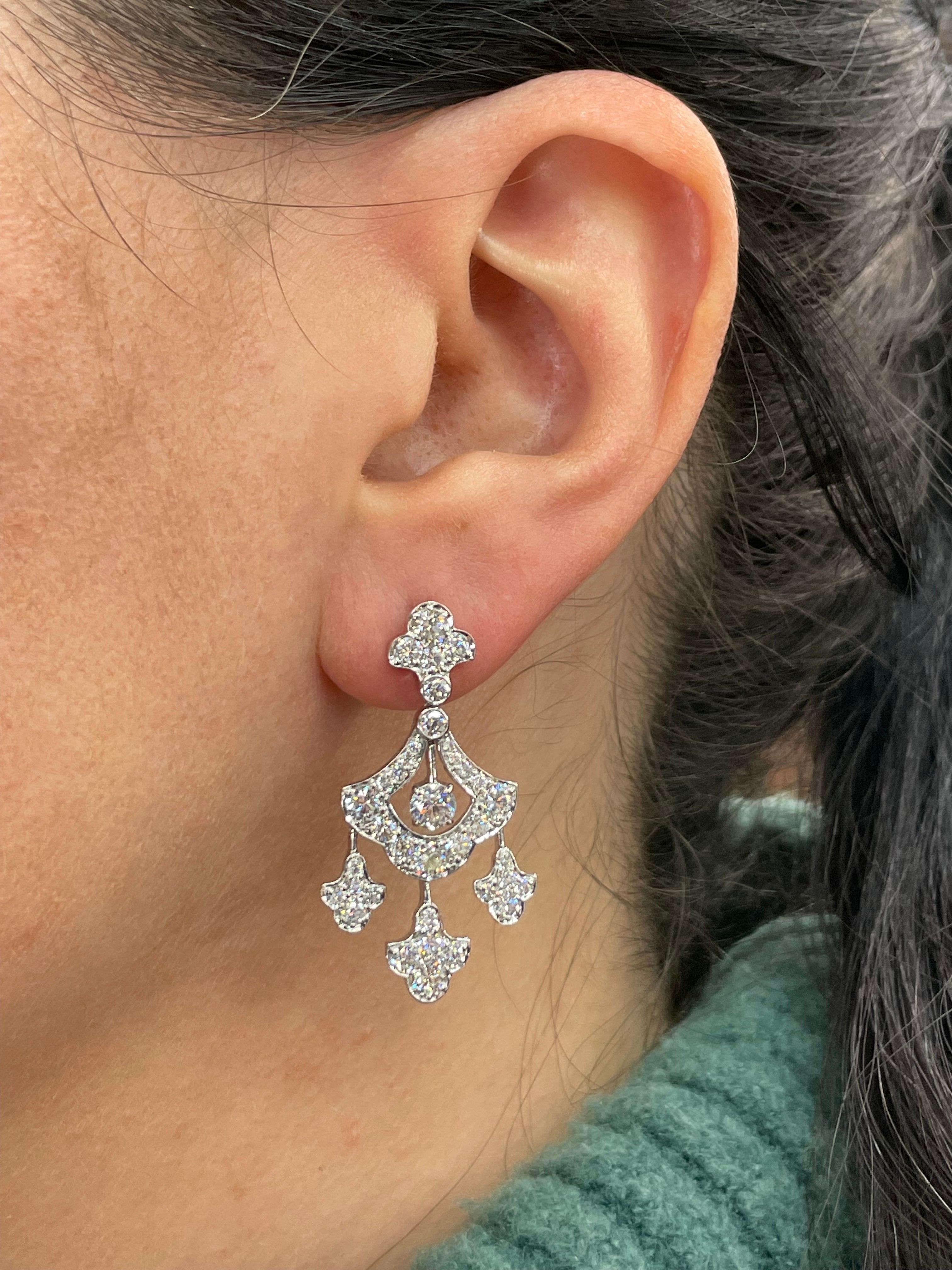 18 Karat White Gold drop dangle earrings featuring 72 Round Brilliants weighing 3.98 Carats. 
Color G-H Clarity SI
Bottom Drops have movement. 