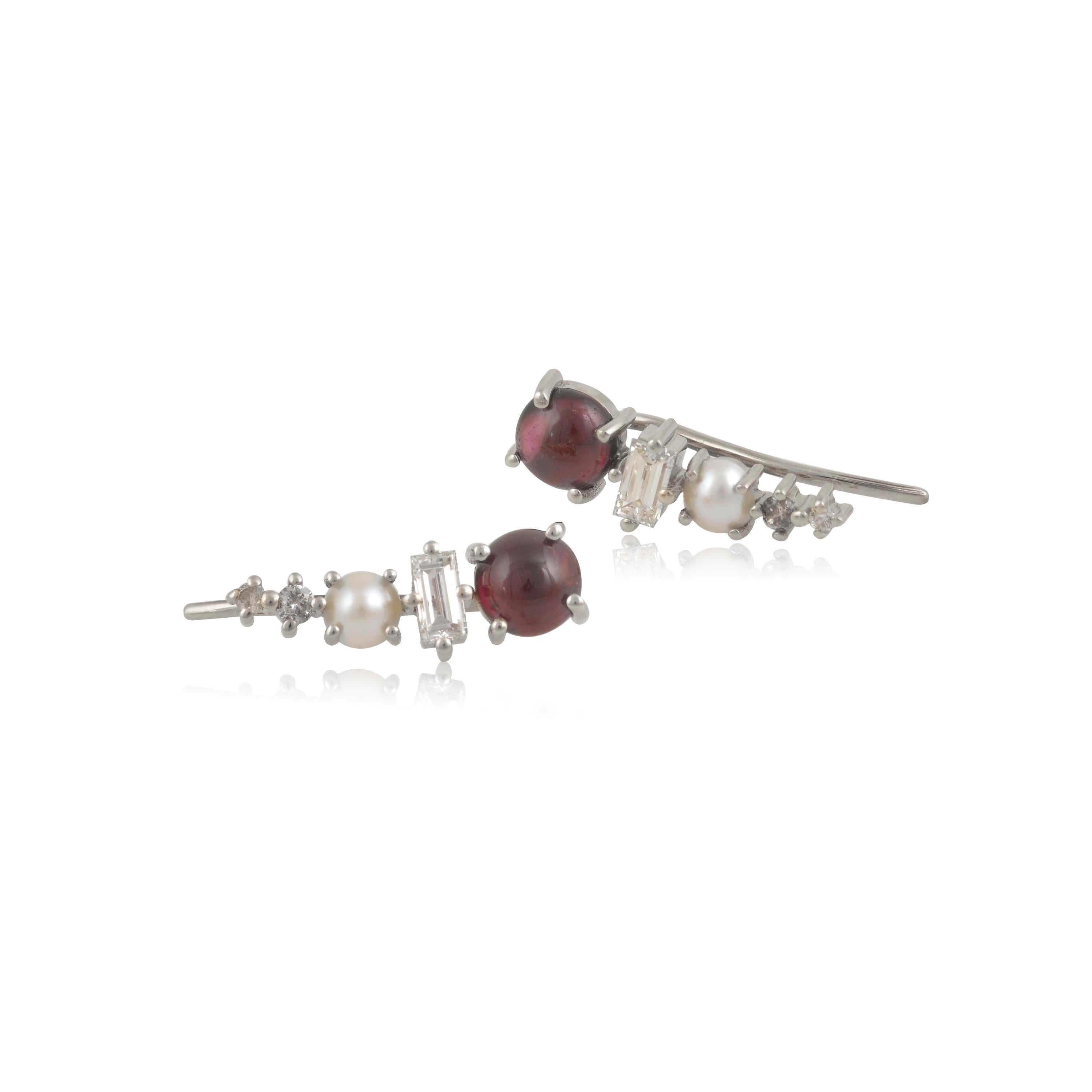 Designer: Alexia Gryllaki
Dimensions: L15x5mm
Weight: approximately 2.1g (pair)  
Barcode: OFS042

Multi-stone ear-climbers in 18 karat white gold with round cabochon rhodolite garnets approx. 1.32cts, round cabochon cultured pearls approx. 0.28cts,