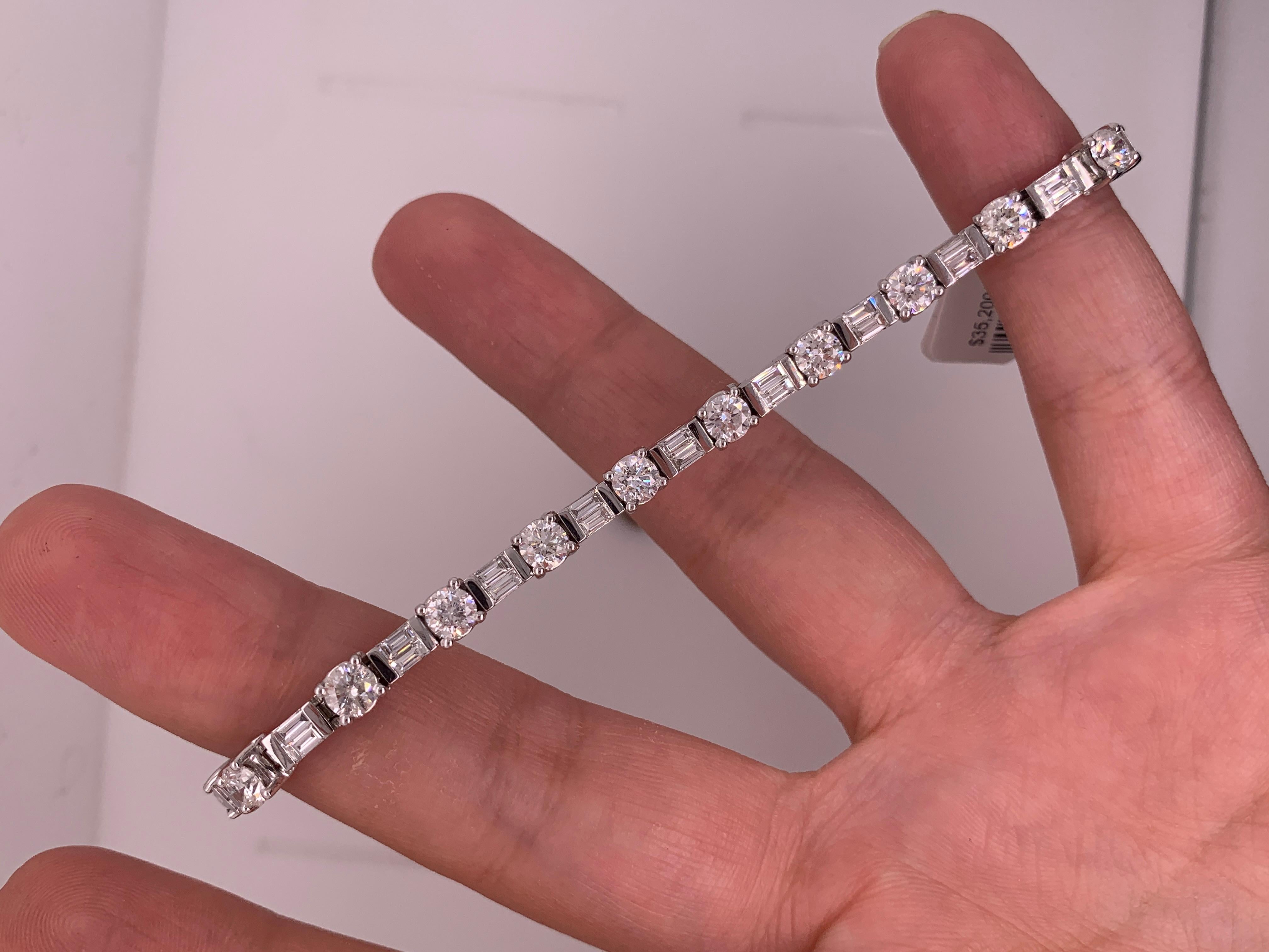 This absolutely elegant and classic bracelet features top quality 17 Round and 34 Baguette cut Diamonds. 
The total diamond weight is 8.50 Carats. 
This is a Bar Set Tennis Bracelet. Each diamond individually important.