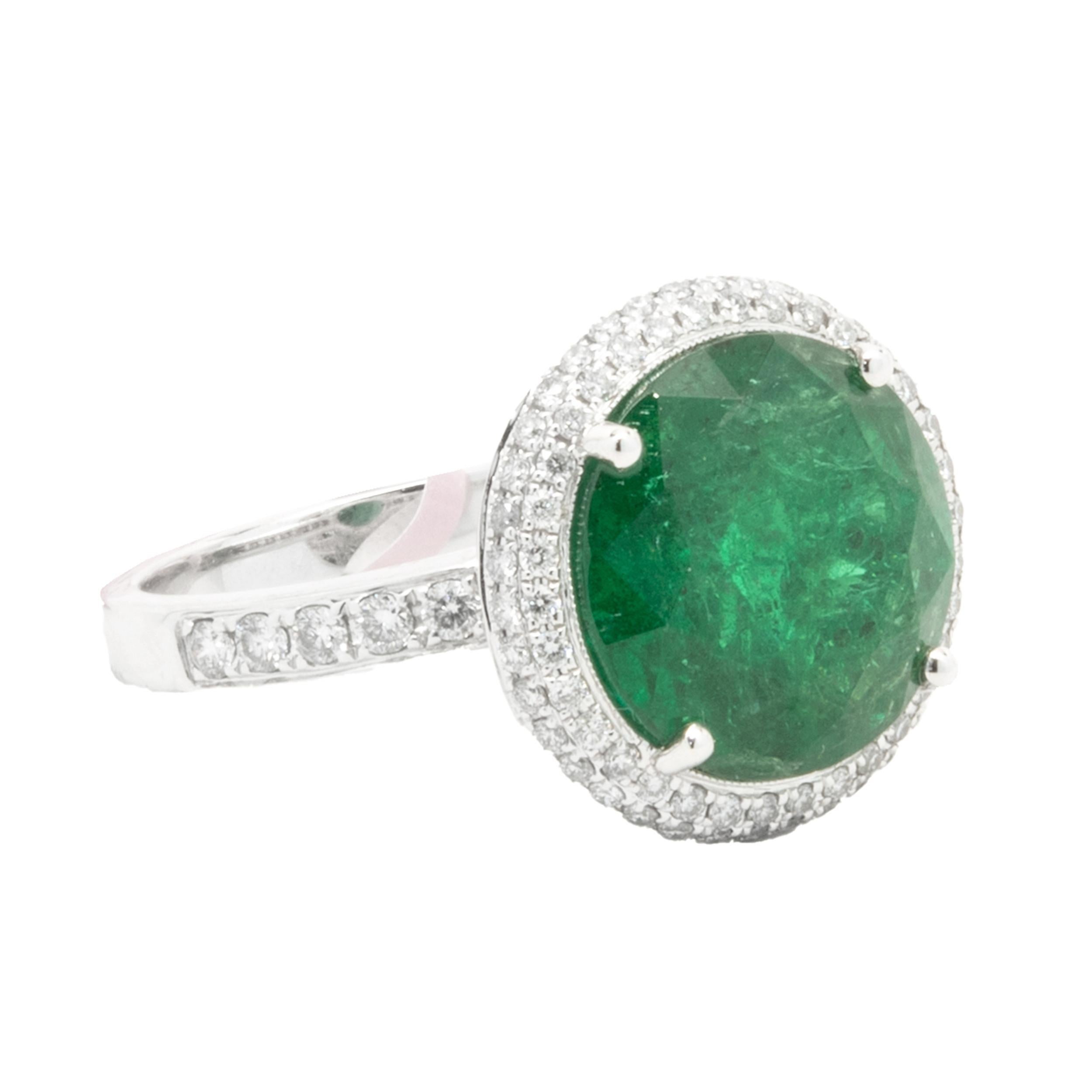 Designer: custom
Material: 18K white gold
Diamond: 174 round brilliant cut = 0.93cttw
Color: G
Clarity: VS2
Emerald: 1 round cut = 7.85ct
Ring Size: 6.5 (complimentary sizing available)
Weight: 8.16 grams