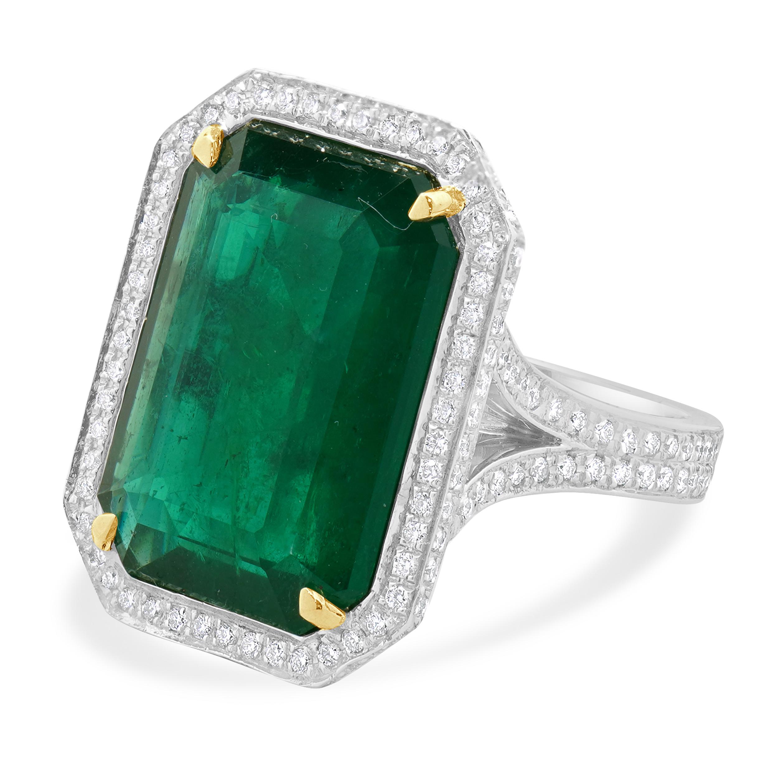 Designer: custom
Material: 18K white gold
Emerald: 1 emerald cut = 11.19ct
Diamond: round brilliant cut = 0.79cttw
Color: H
Clarity: SI1
Ring Size: 6.5 (please allow two extra shipping days for sizing requests) 
Weight: 12.46 grams