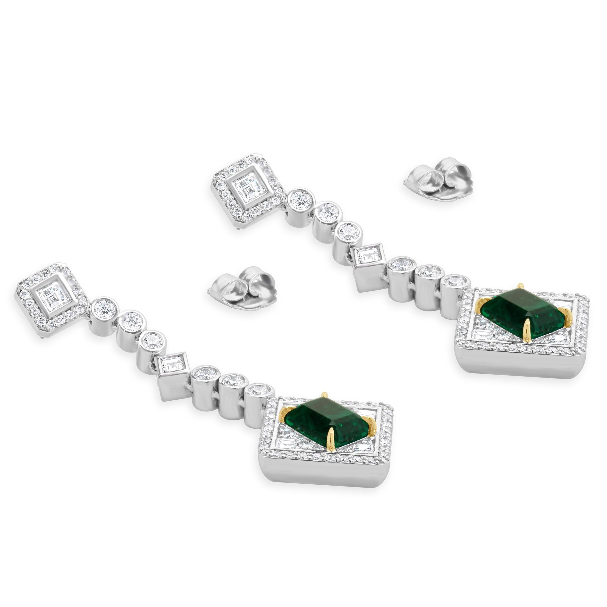 Designer: custom
Material: 18K white gold
Diamond: multi shaped cut= 4.24cttw
Color: G
Clarity: VS
Emeralds: 2 emerald cut = 6.03cttw
Weight: 29.93 grams
