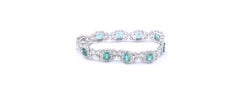 18 Karat White Gold Emerald and Diamond Flower Link Bracelet
