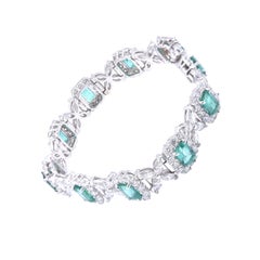 18 Karat White Gold Emerald and Diamond Flower Link Bracelet