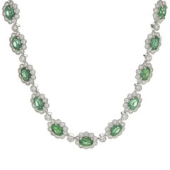 18 Karat White Gold Emerald and Diamond Halo Collar Necklace