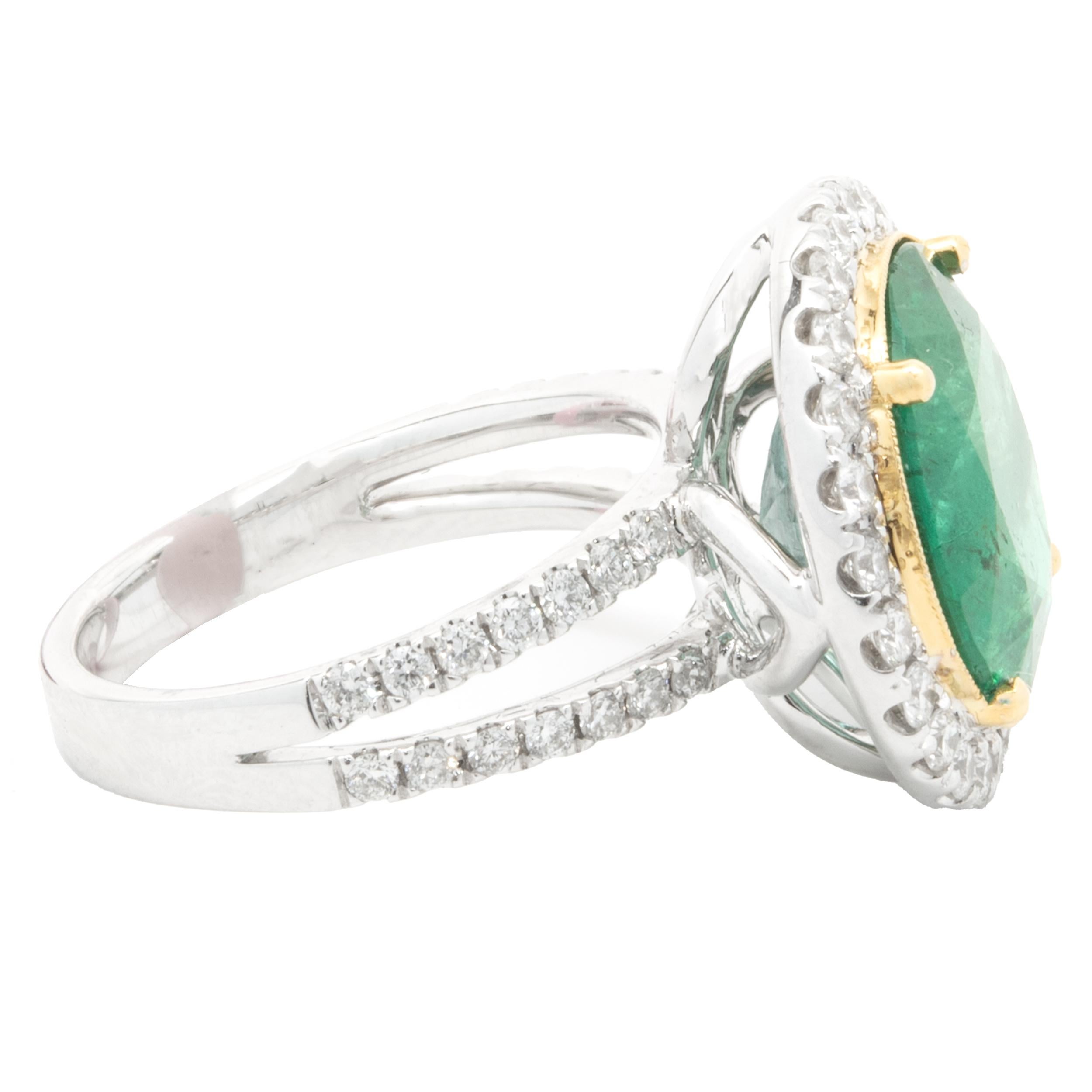 Round Cut 18 Karat Two Tone Emerald and Diamond Halo Ring For Sale
