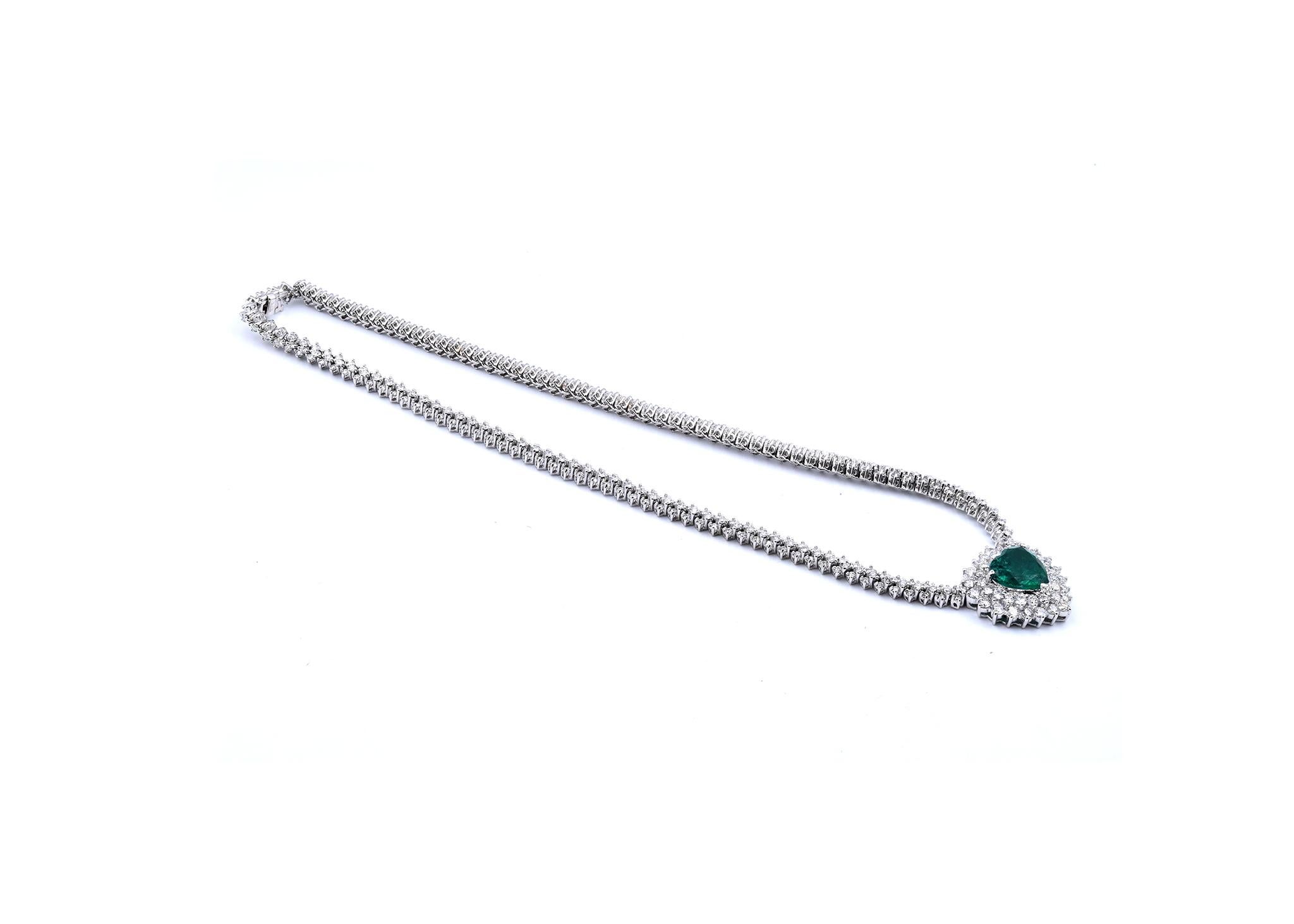 Material: 18K white gold
Diamonds: 396 round brilliant cut = 14.25cttw
Color: G
Clarity: VVS1-2
Emerald: 1 heart cut = 7.36ct
Color: highly saturated deep Kelly green 
Clarity: AAA
Dimensions: necklace measures 18-inches, pendant measures 51.5 X