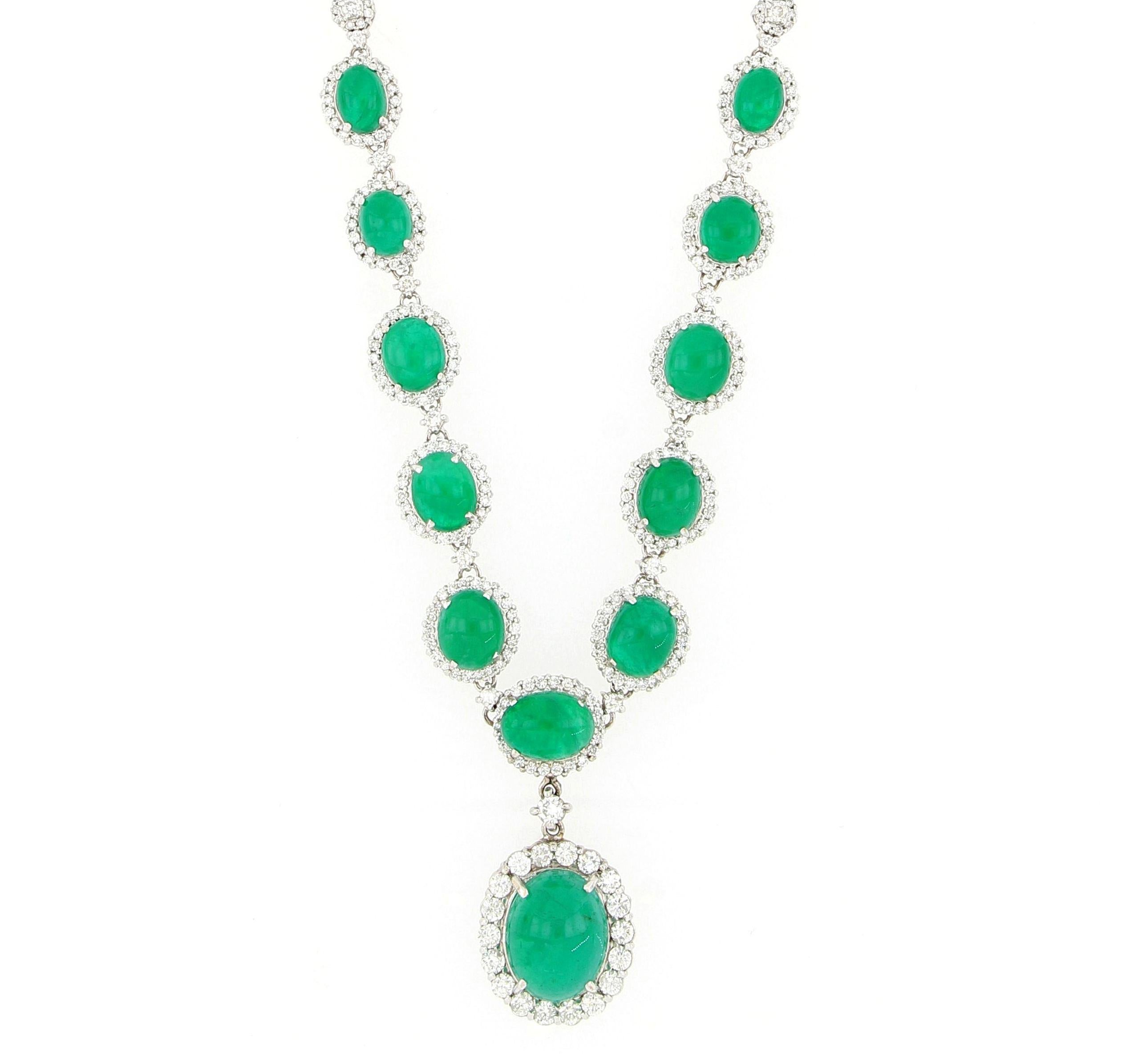 A magnificent  necklace  set with oval cabochon natural emerald of vivid bright green colour and very good lustre, weighing 28.34 carats in total accented with round brilliant cut diamonds  weighing 5.87 carats, mounted in 18 karat white