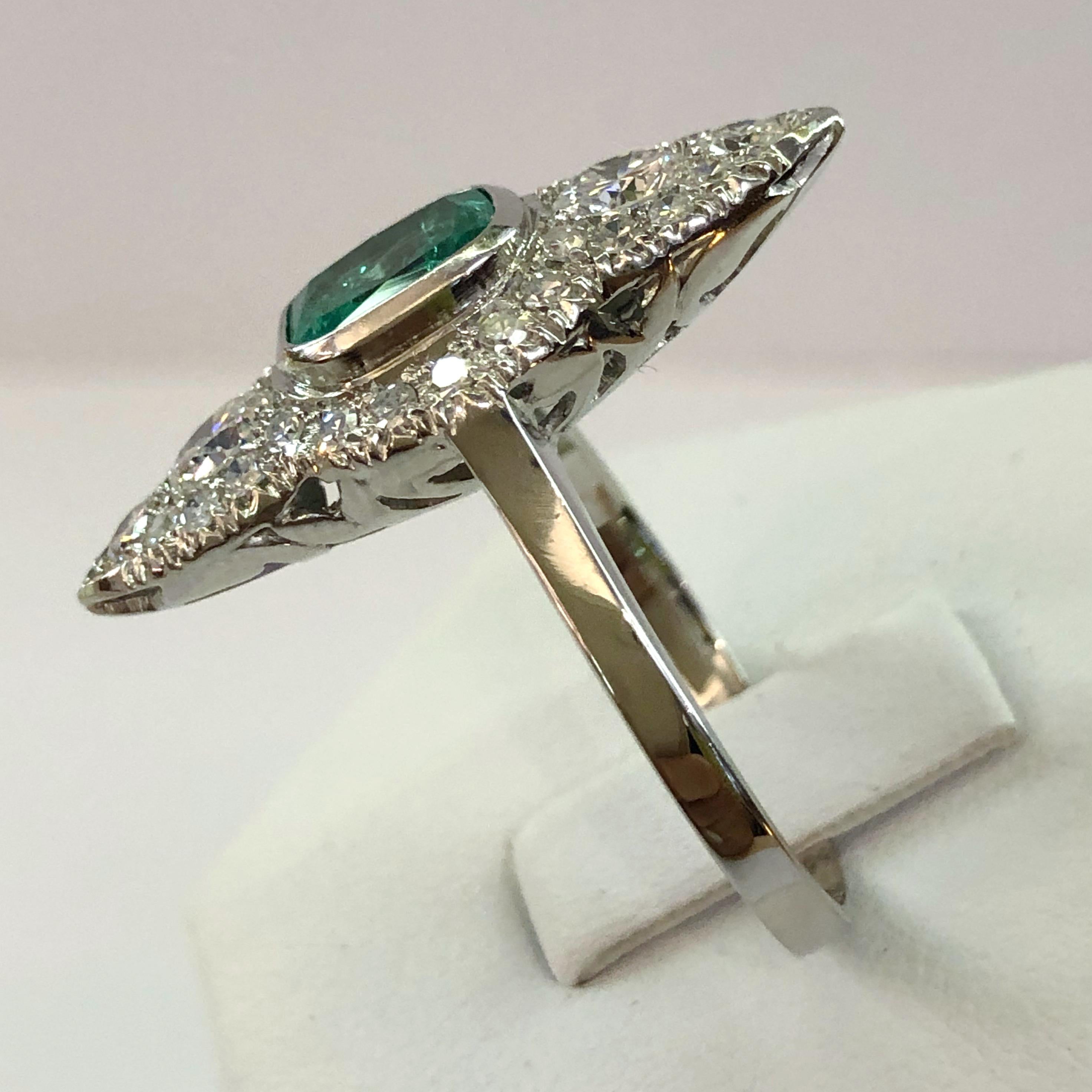 18 karat white gold lozenge shaped ring with a central emerald of 1.2 karats and brilliant diamonds for a total of 1 karat, Italy 1930s
Ring size US 8.5