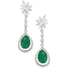 18 Karat White Gold Emerald Carving and Diamond Dangling Earrings