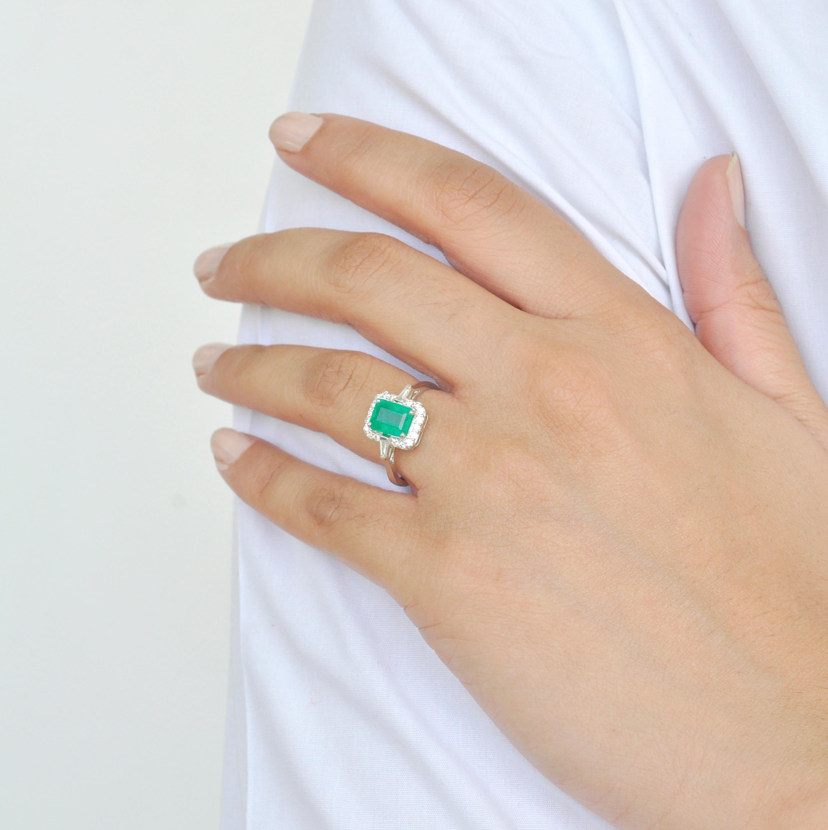 Women's 18 Karat White Gold Emerald Cut Colombian Emerald Diamond Contemporary Ring For Sale