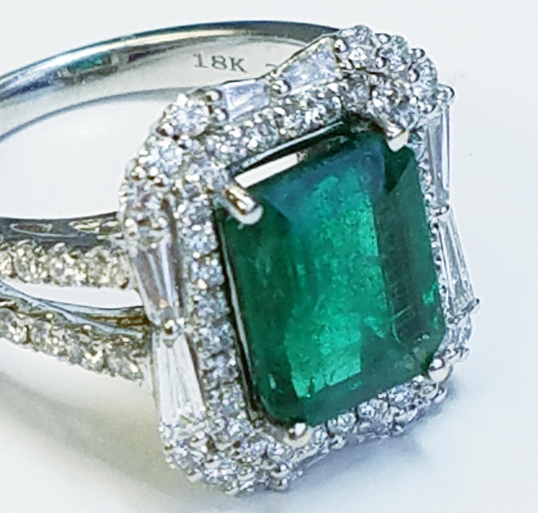 18k White Gold Emerald Cut Emerald and Diamond Ring
3.43 carats of Emeralds
1.22 carats of Diamonds 
Emerald cut
18k white gold