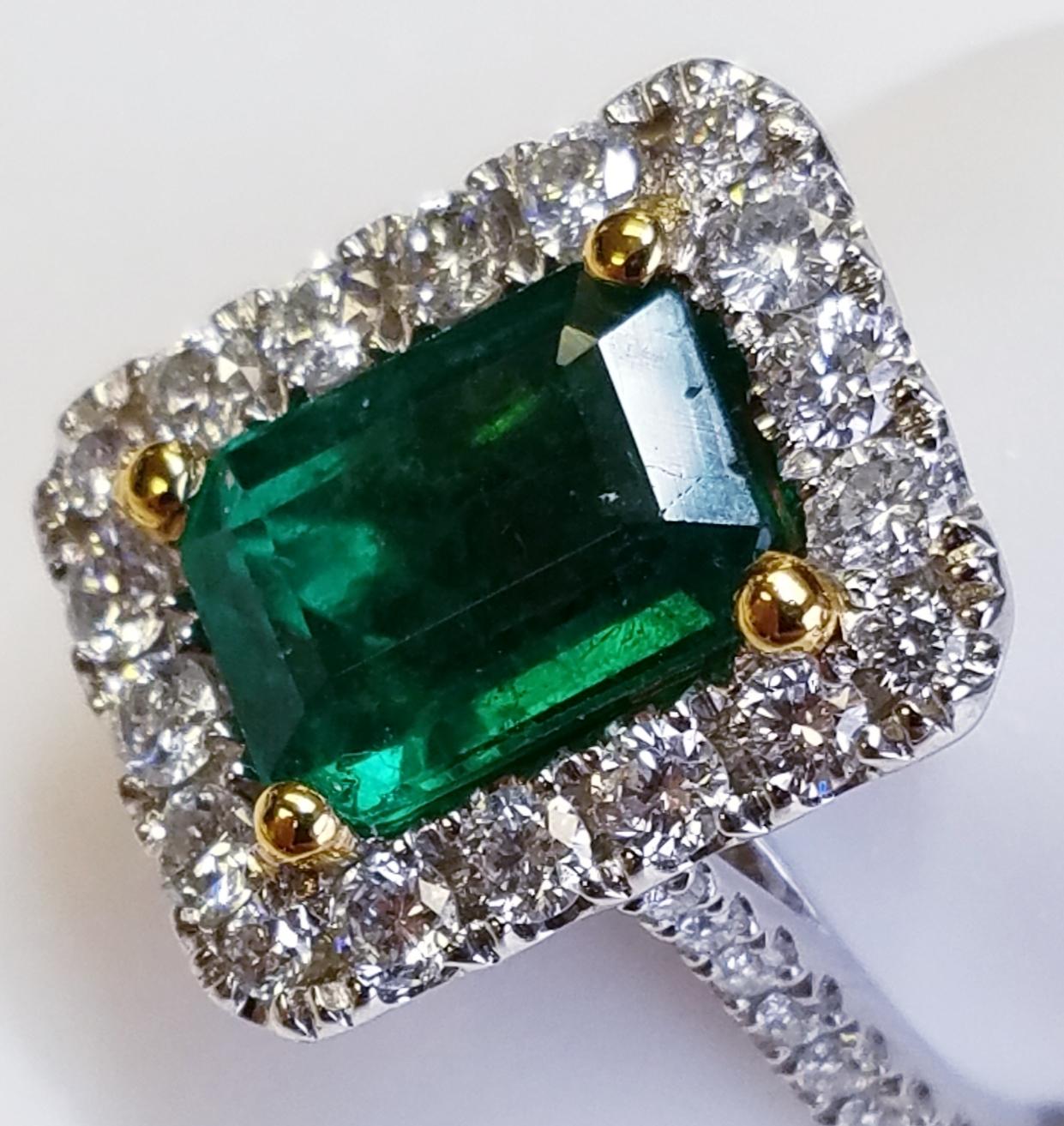 18 Karat White Gold Emerald Cut Emerald and Diamond Ring In New Condition For Sale In Great Neck, NY
