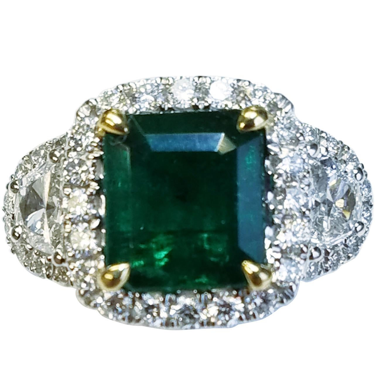 18 Karat White Gold Emerald Cut Emerald and Diamond Ring