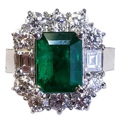 18 Karat White Gold Emerald Cut Emerald and Diamond Ring 17235