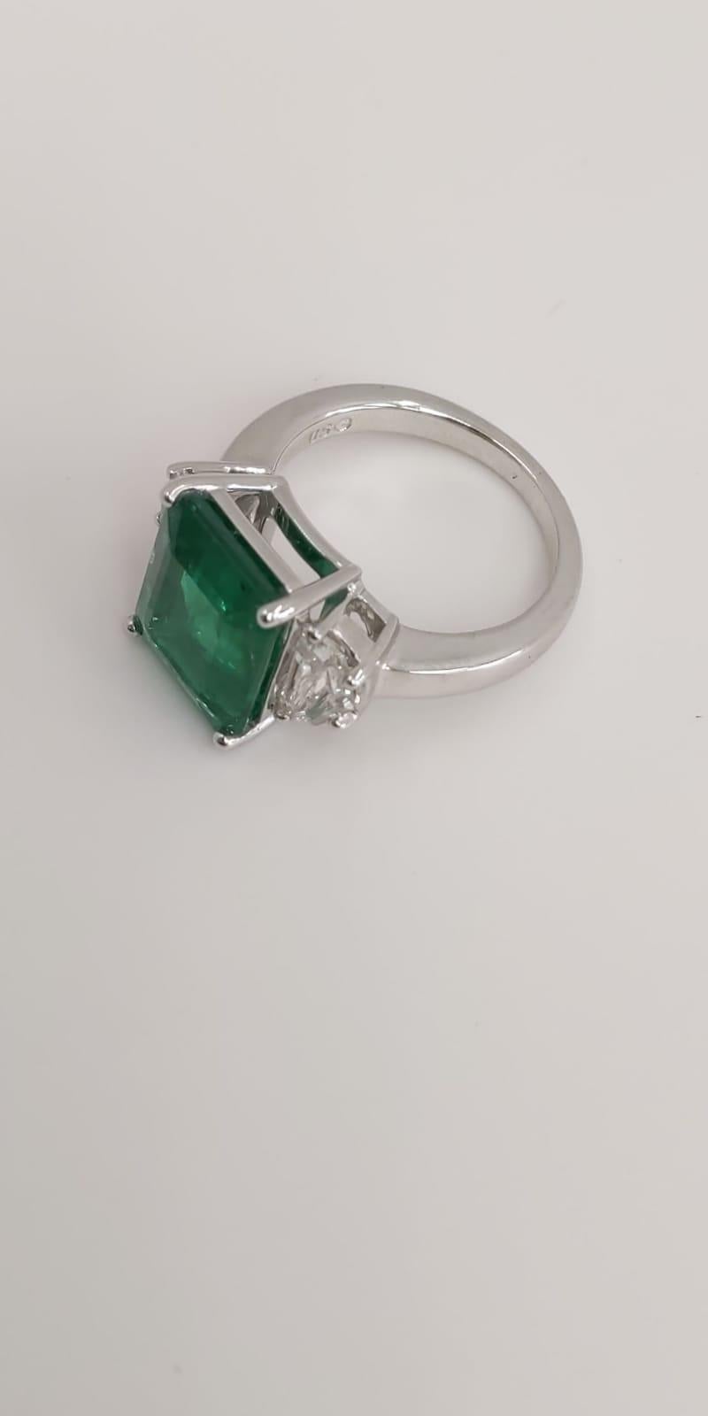 18 Karat White Gold Emerald Cut Emerald and Diamond Three Stone Ring
6.77 Carats of Emeralds
0.92 Carats of Diamonds
18 Karat White Gold 
Emerald Cut
Three Stone Ring