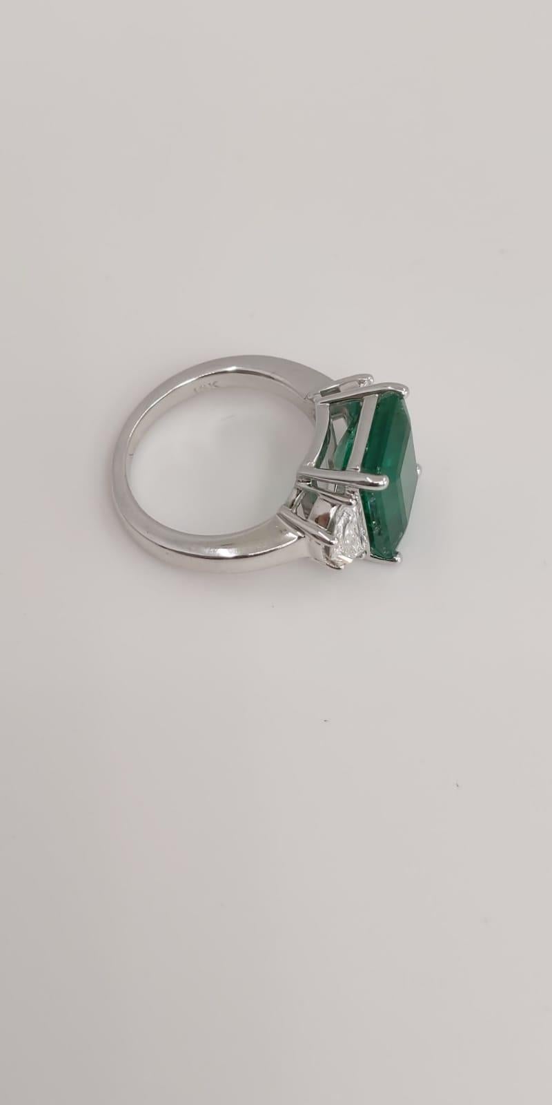 Contemporary 18 Karat White Gold Emerald Cut Emerald and Diamond Three-Stone Ring For Sale